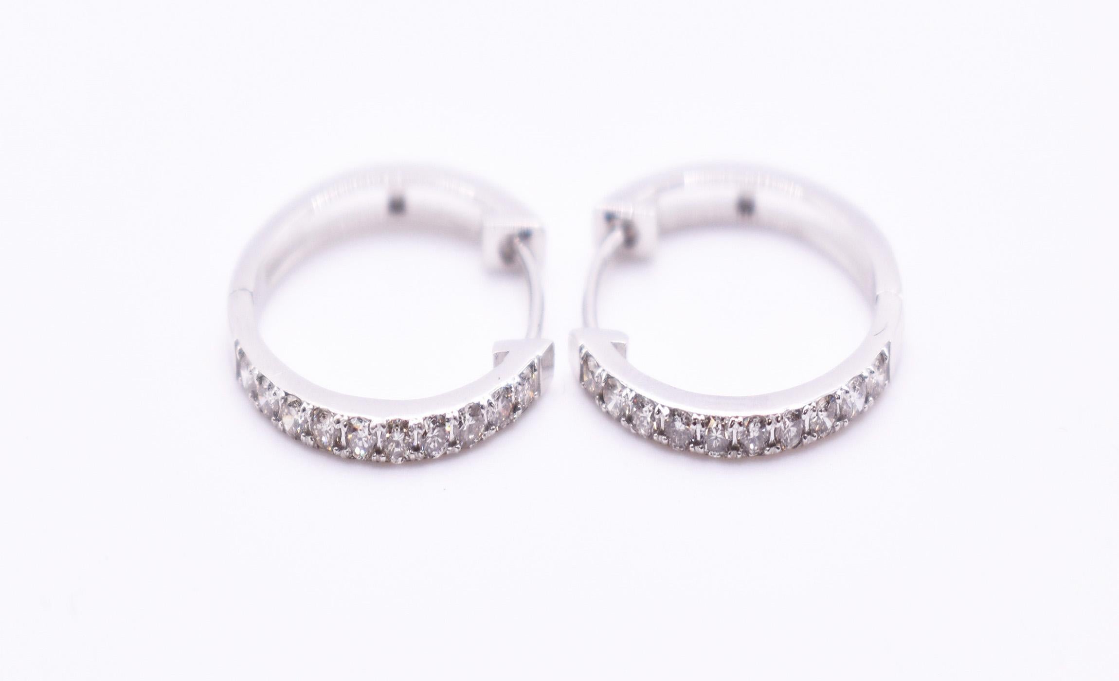A fine pair of 18k gold diamond hoop earrings. Diamonds = 0.30ct Gold weight = 2.01g