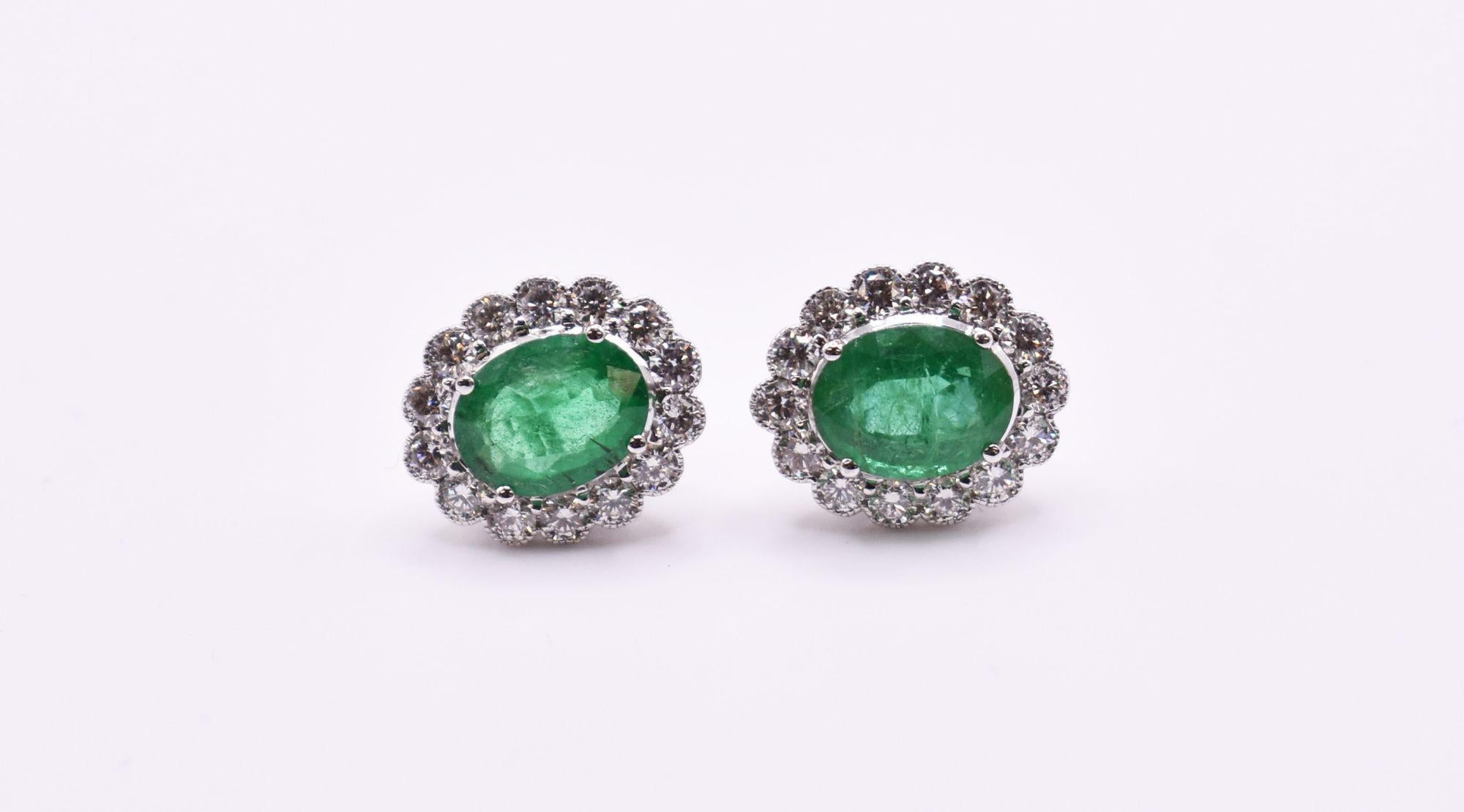 A fabulous pair of 18k white gold emerald and diamond earrings, having a claw set emerald of very nice colour and decent quality emerald which weighs 3.23 ct, each having 14 miligrain set diamonds.

Emerald: 3.23ct
Diamond: 1.26ct
Gold: 4.84g

RRP: