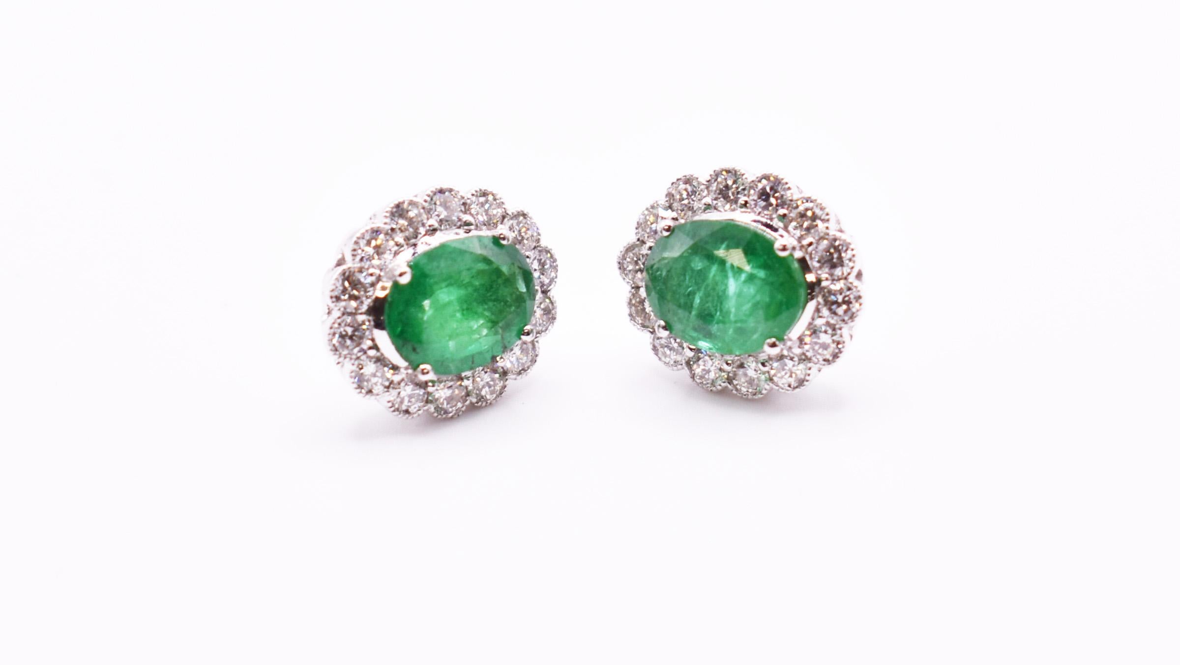 A fabulous pair of 18k white gold emerald and diamond earrings, having a claw set emerald of very nice colour and decent quality emerald which weighs 3.23 ct, each having 14 miligrain set diamonds. 

Emerald: 3.23ct
Diamond: 1.26ct
Gold: 4.84g

RRP: