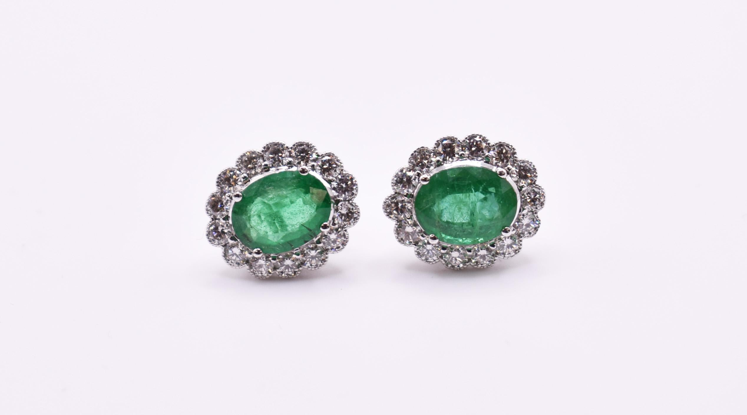 Oval Cut Pair of 18k White Gold Emerald & Diamond Earrings For Sale