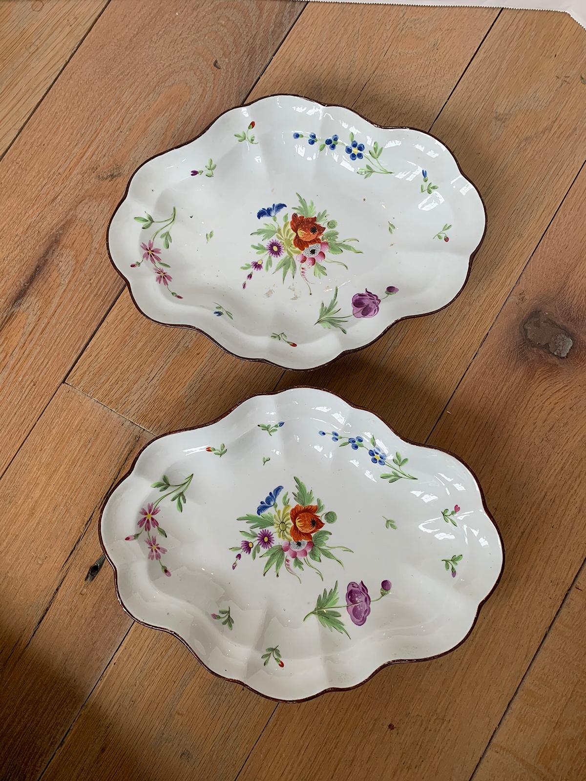 Pair of 18th-19th century possibly French faience floral serving platters, marked with pattern # 582. Unidentified marker.