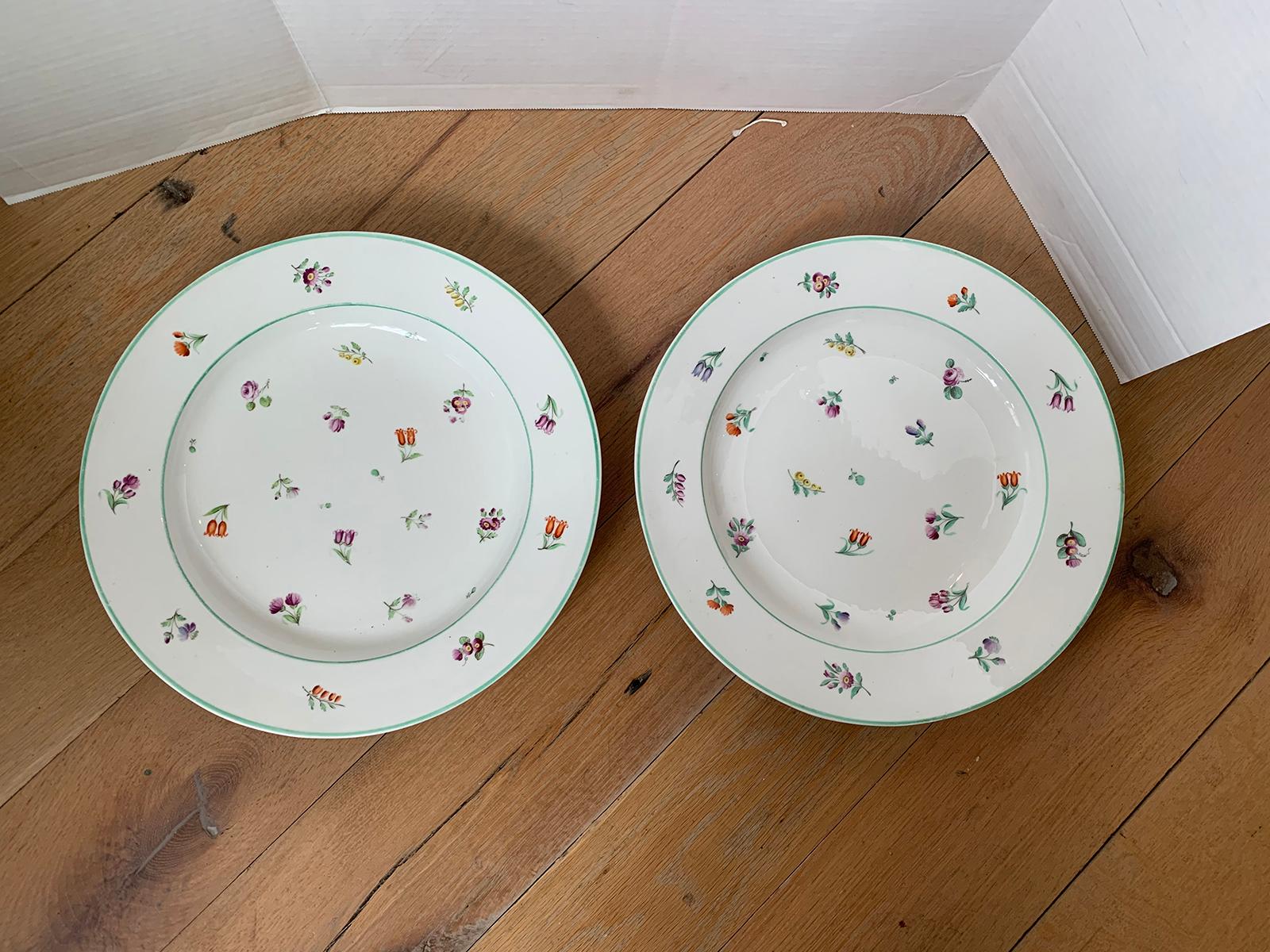 Pair of 18th-19th century French sprig pattern porcelain round chargers with green trim, unmarked.