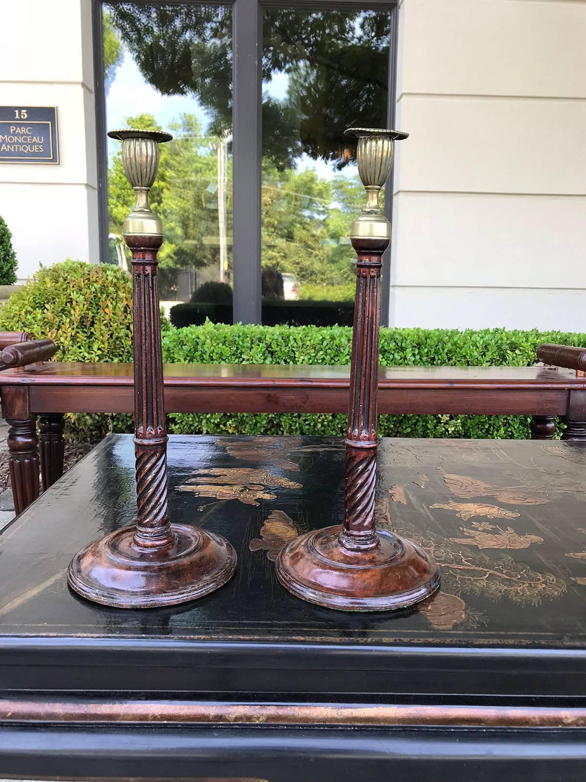 Pair of 18th-19th century George III style antique brass-mounted candlesticks.