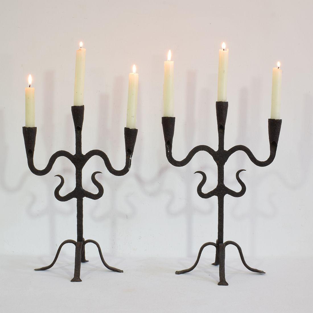 Beautiful pair of 18th-19th century hand forged iron candleholders, Southern France, Spain, circa 1750-1850. Weathered.
more photo's available on request.
Measures: H:36-38cm, W:25-26cm, D:19,5cm.