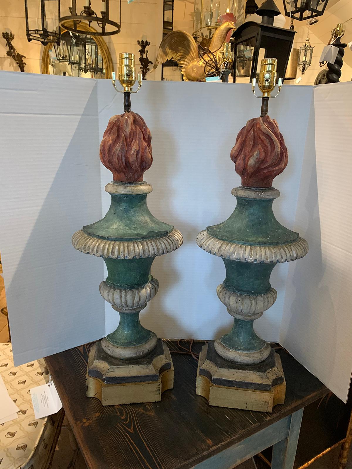 Pair of 18th-19th century Italian hand carved wood polychrome urns as lamps with custom bases.
New wiring.