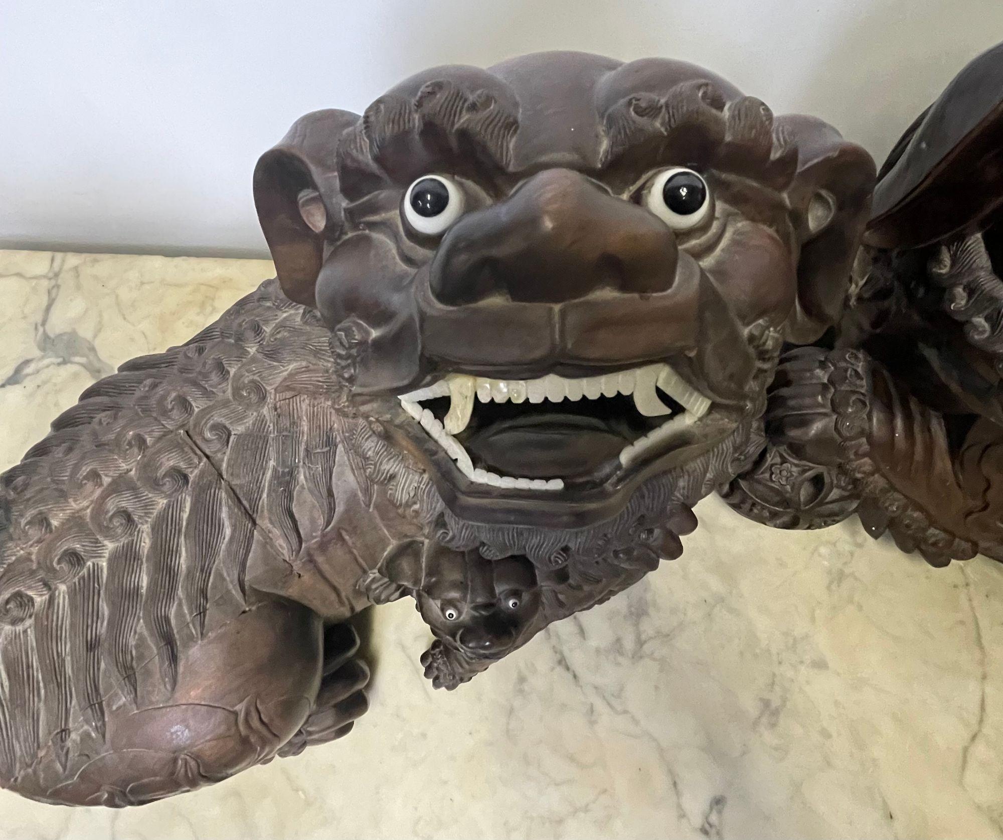 Pair of 18th/19th Century Solid Teak Foo Dogs, Opposing, Statuary In Good Condition For Sale In Stamford, CT