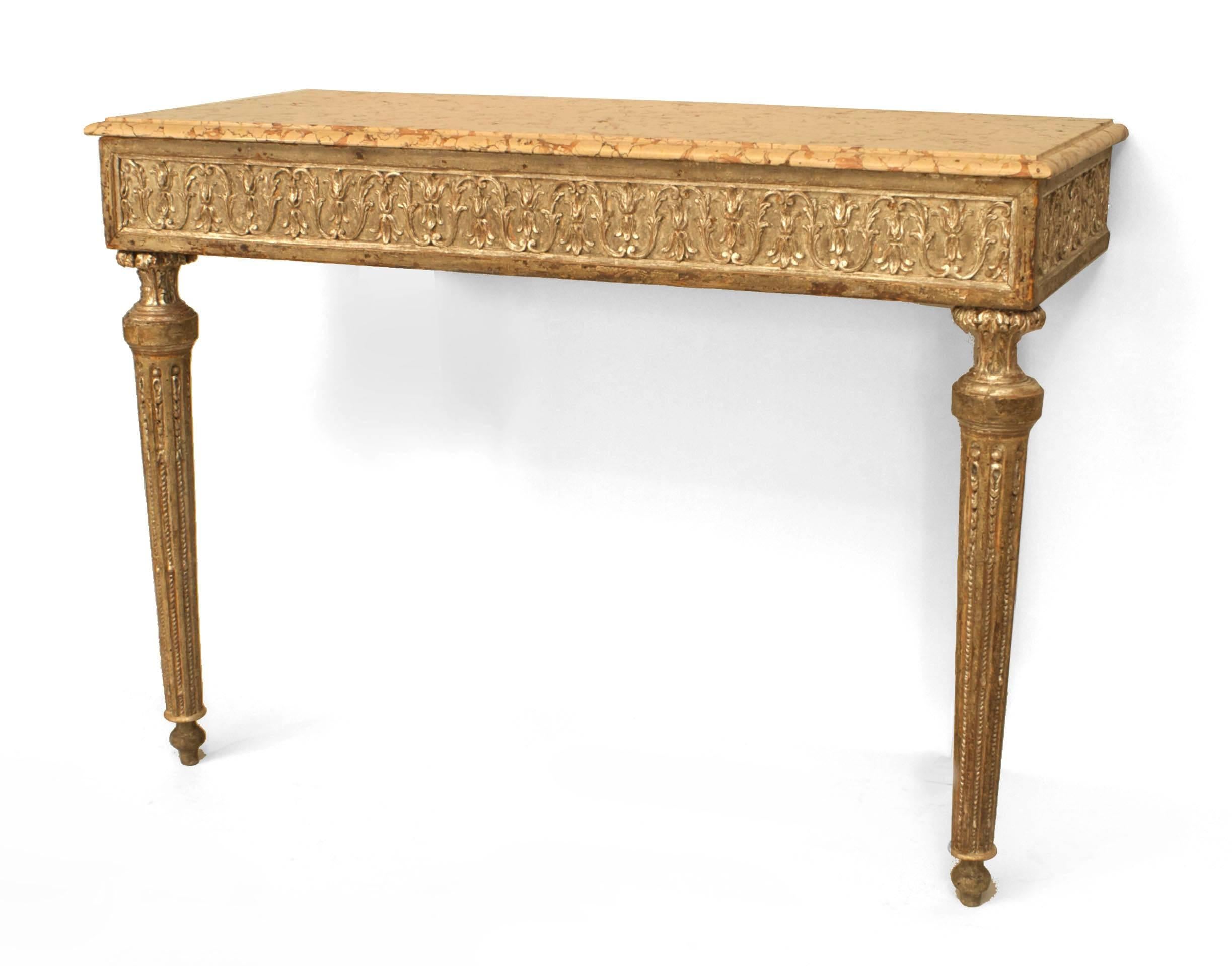 Pair of Italian Neo-classic (18th Century) silver gilt bracket form console tables with 2 round fluted tapered front legs and a carved apron supporting rectangular marble tops. (PRICED AS Pair)
