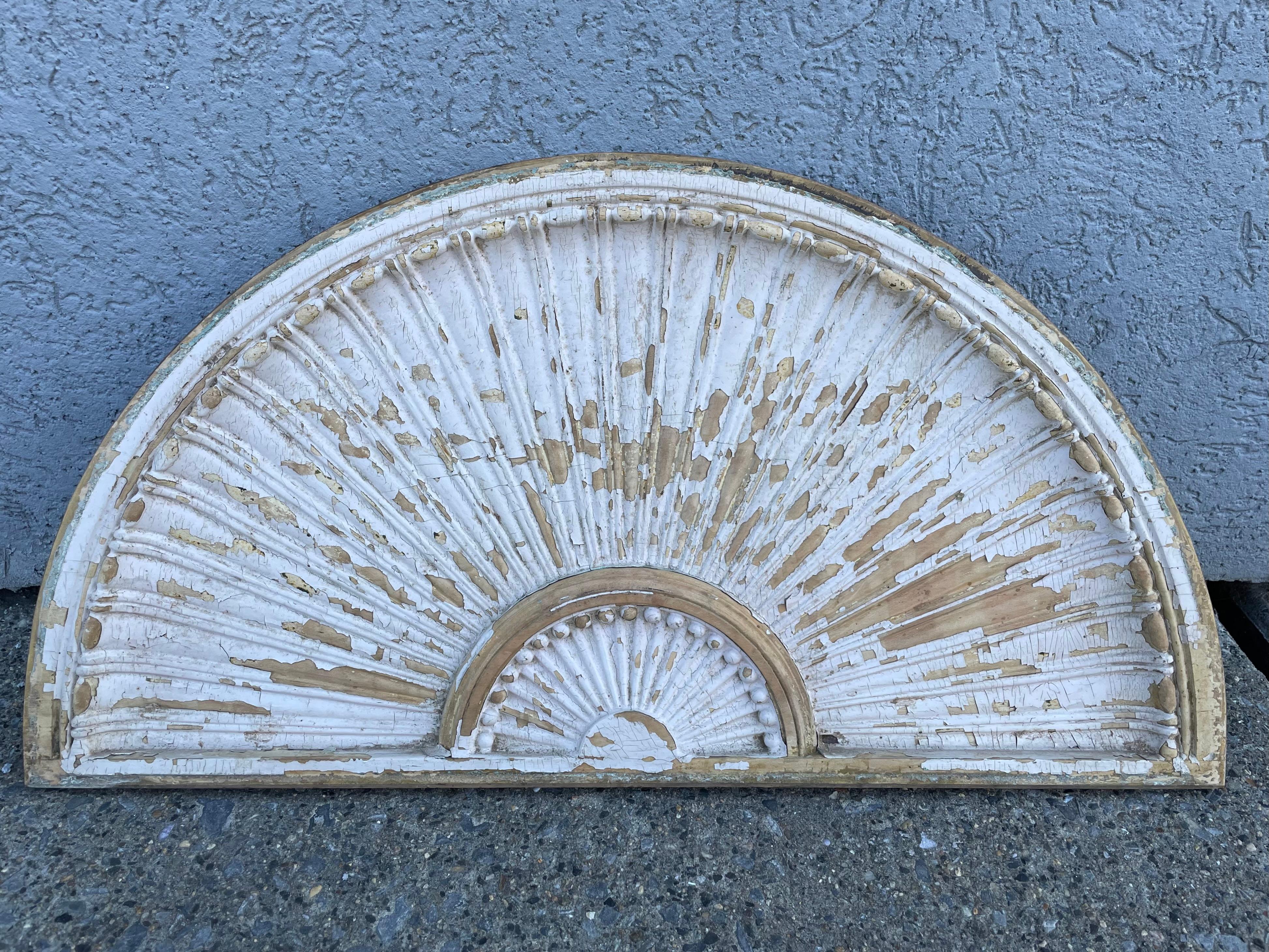 Wonderful pair of fan shaped late 18th century American Federal period lintels or over doors with exquisitely detailed carving. The distressed painted surface adds a lot of character, they can also be stripped to further reveal the expert