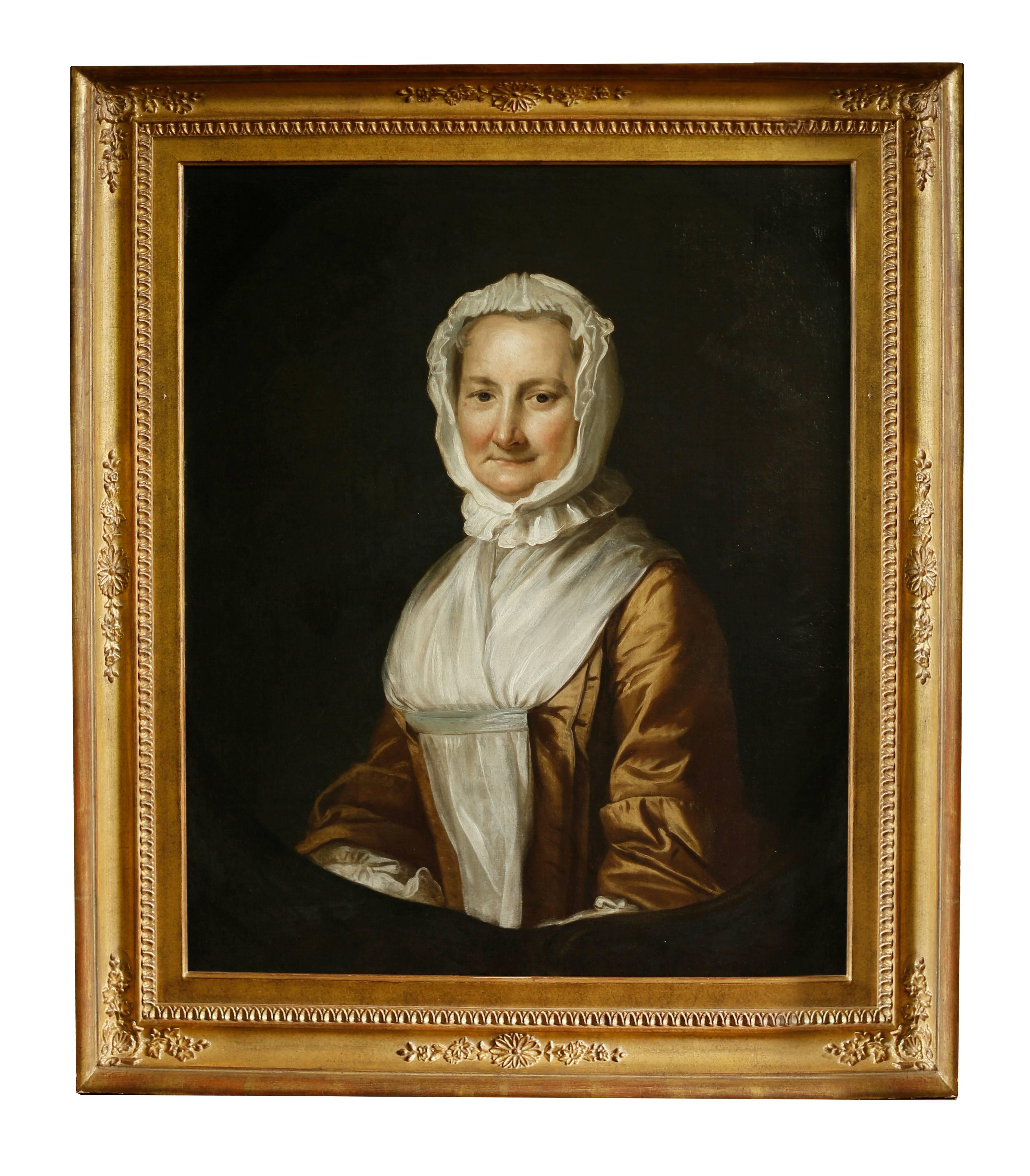 An attractive pair of colonial American mid-18th century oil on canvas portraits. The detail and rendering of the paintings is of extremely fine quality. Highly contrasted figures against the dark backgrounds references the earlier work of