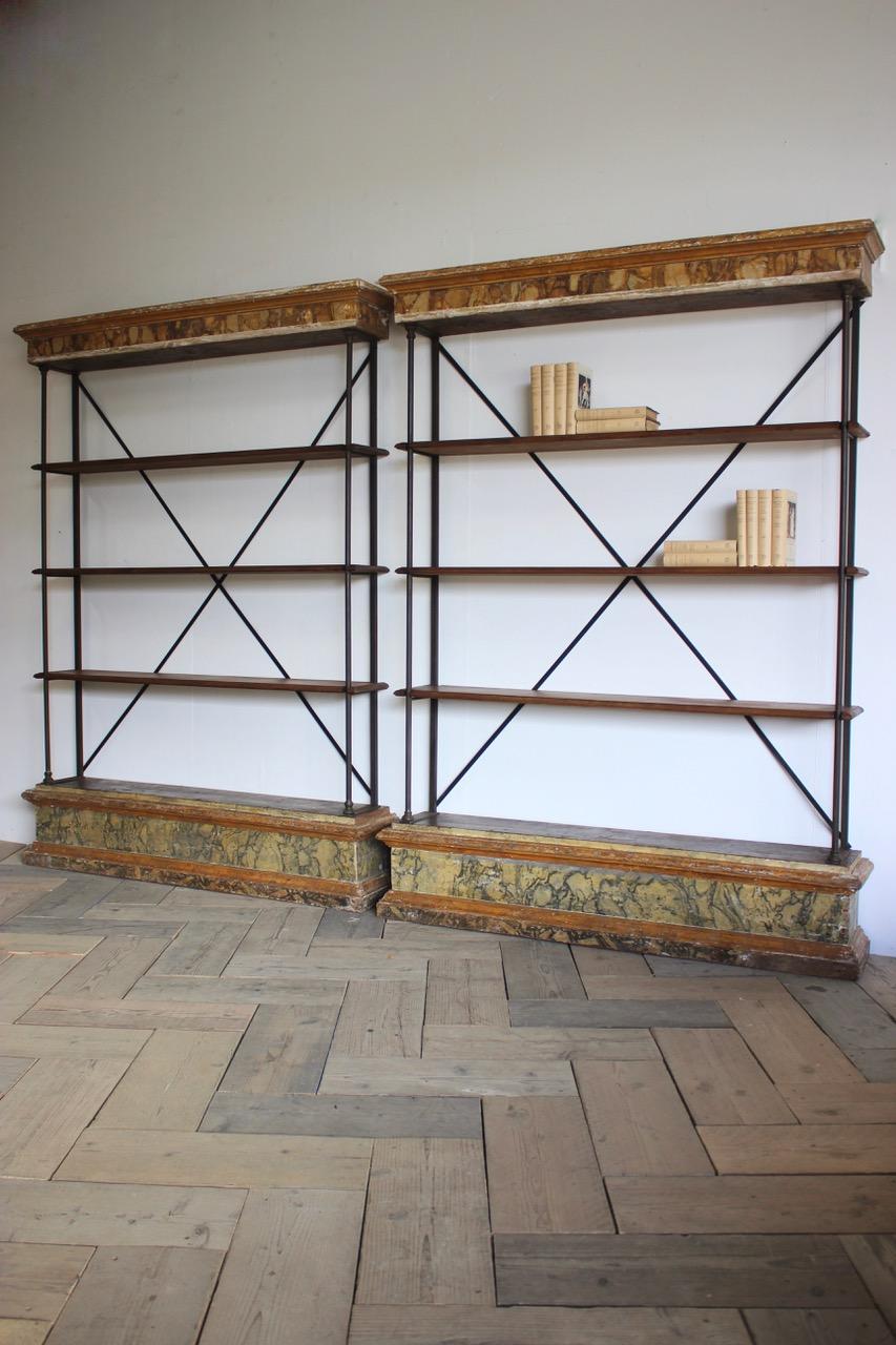 A very striking pair of 18th century and later, display cabinets or bookcases of simple lines, made out of 18th century painted elements with later steel bars, that will work well in a contemporary setting.
Original paint.
