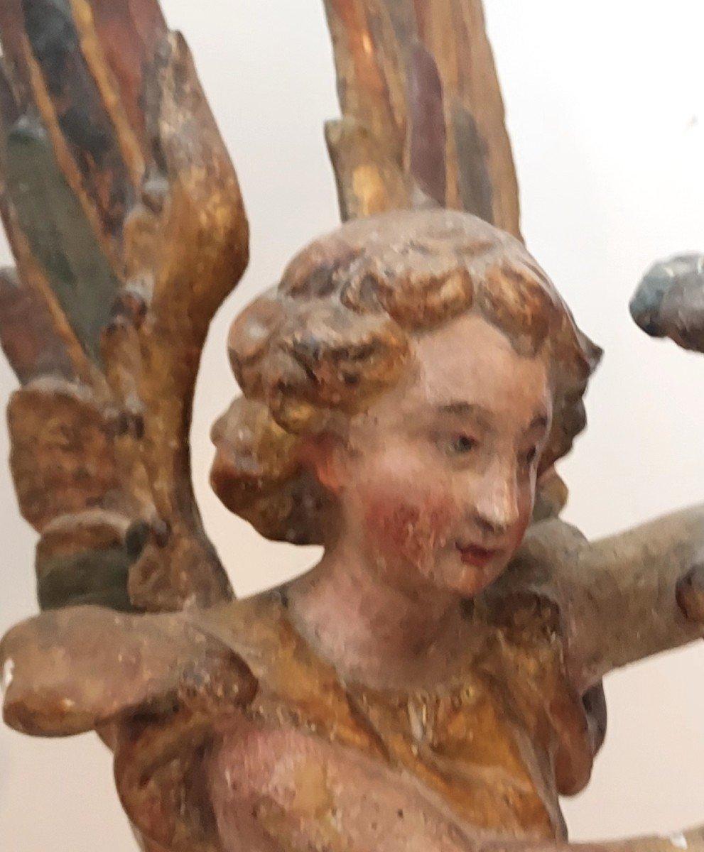 A pair of Italian 18th Century Candle-holding Archangels, sculpted wood with its original wings.  