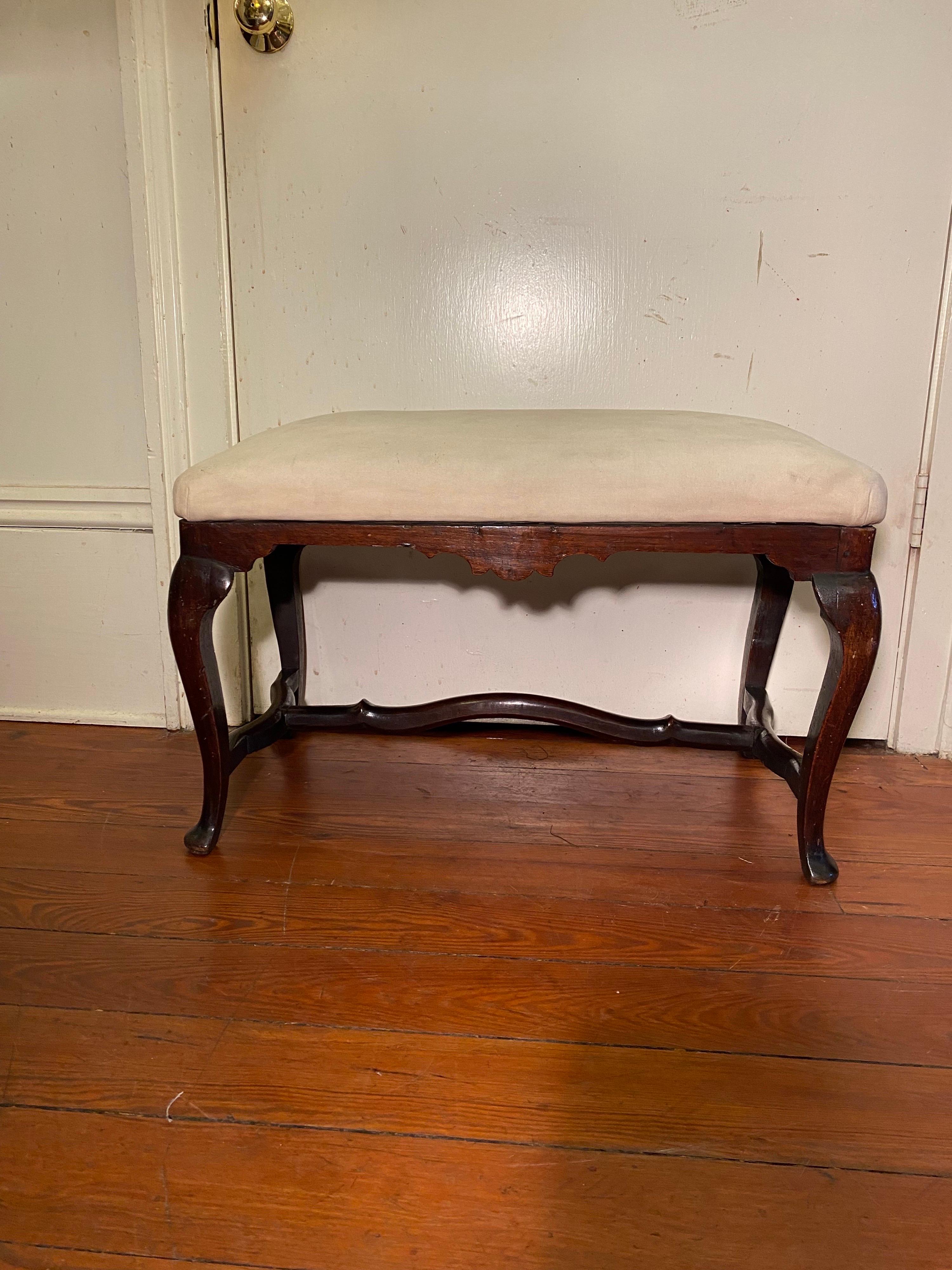 Pair of walnut Spanish benches with cabriole legs and stretcher, removable top.