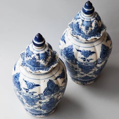 Pair of 18th Century Blue and White Faience Baluster Vases with Shaped Lids