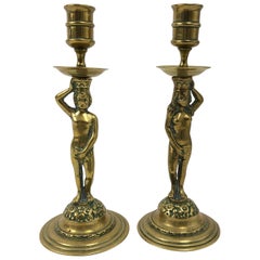 Pair of 18th Century Brass Adam and Eve Figural Candlesticks