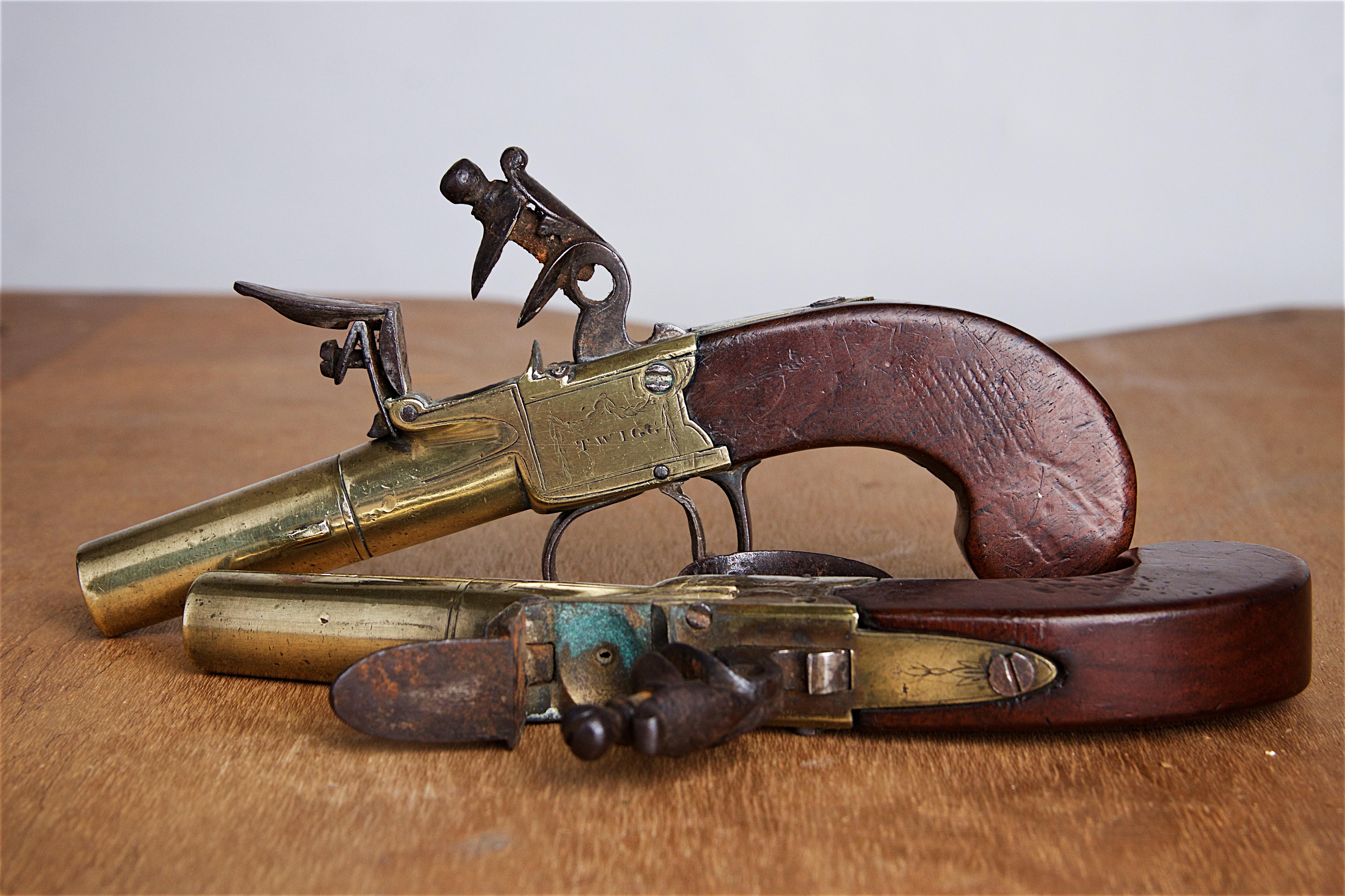 Pair of 18th century pistols by renowned London gunmaker, John Twigg.
Twigg was a master of his craft and these pistols bear the marking “Twigg” on one side of the action and “London” on the other side.
Mahogany grip with screw off brass