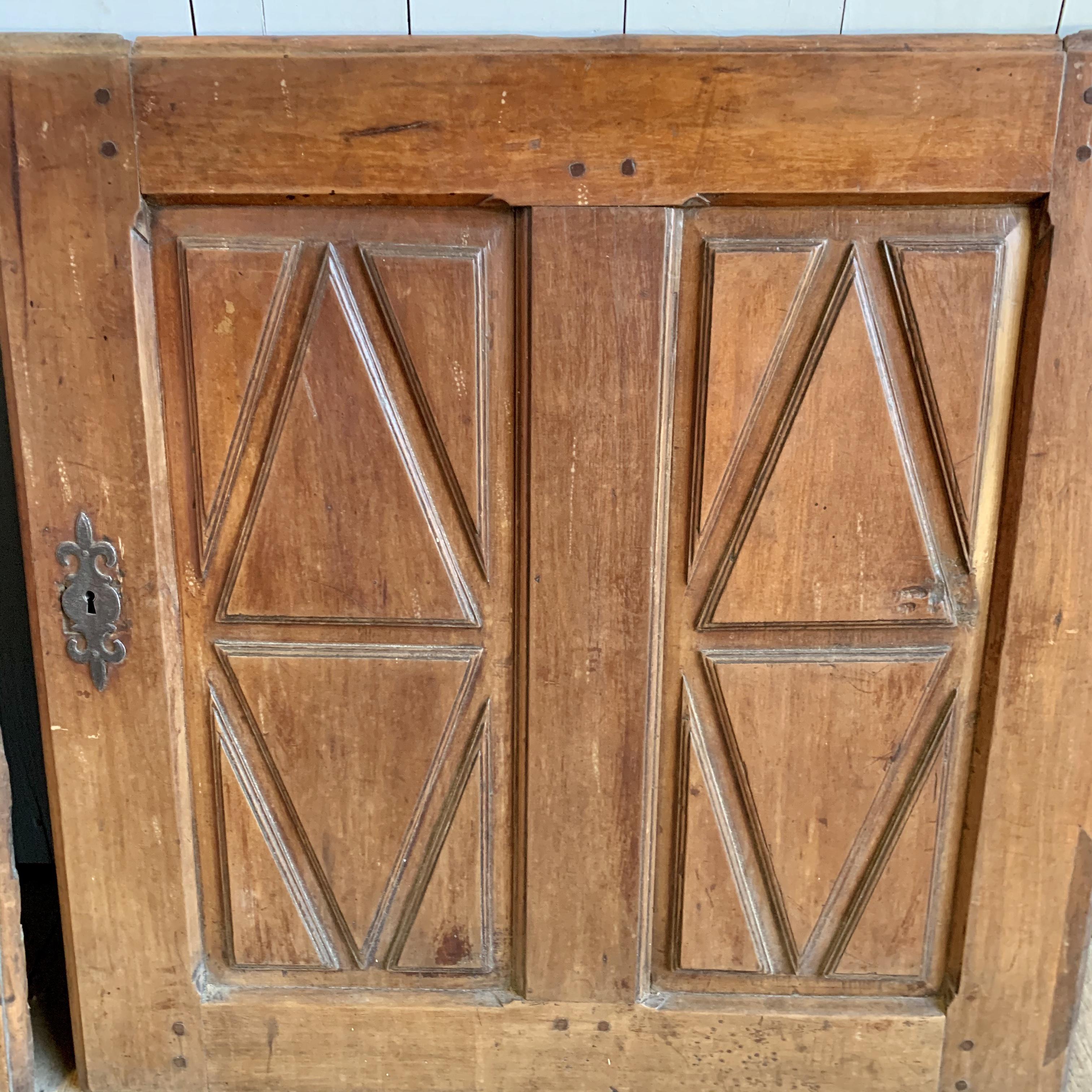 Pair of early 18th century Cherrywood cabinet doors. 62