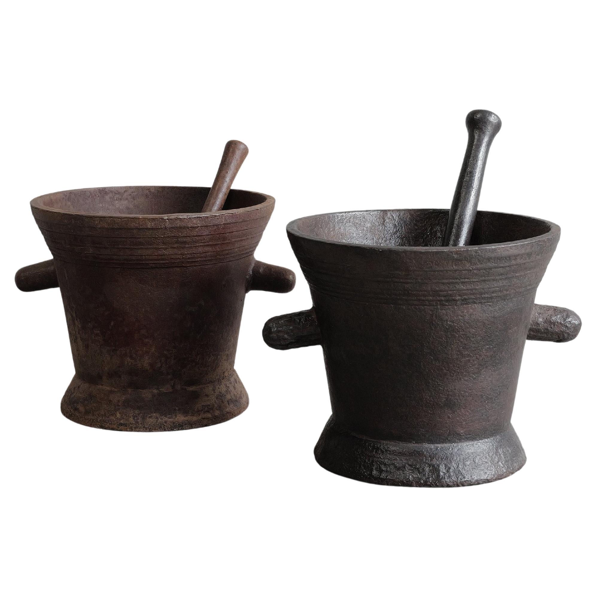 Pair of 18th Century Cast Iron Mortars with pestle