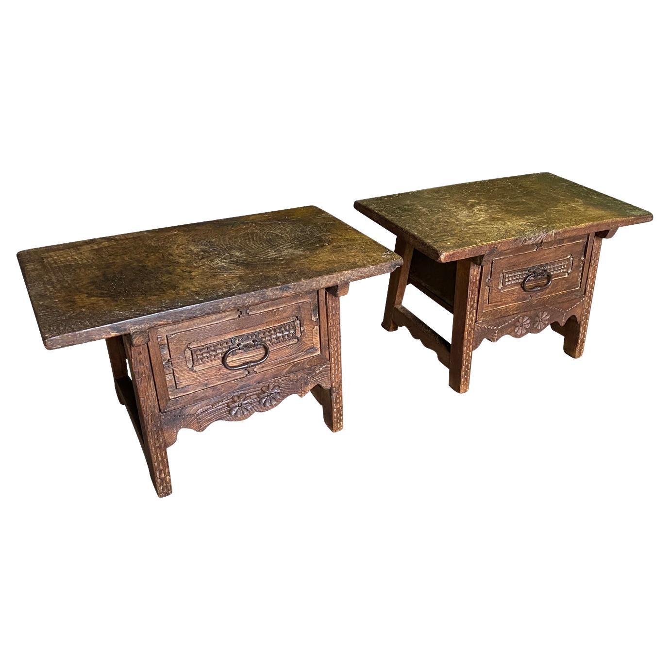 An outstanding pair of 18th century Side Tables from the Catalan region of Spain.  Beautifully constructed from chestnut and meleze (a very hard pine) with solid board tops, single drawers, charming carving detail and slightly splayed legs.  Super