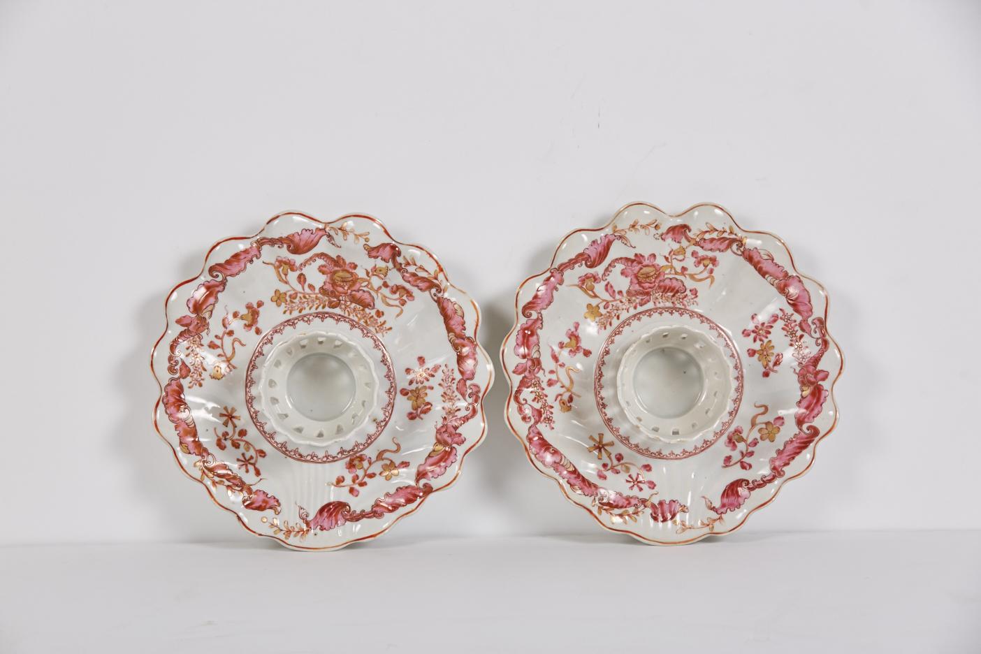 A pair of Chinese export porcelain mancerinas or trembleuses likely made for the Spanish/Spanish Colonial market. Based on a silver form, the standing central ring was designed to support and steady a cup and originally used for serving chocolate.