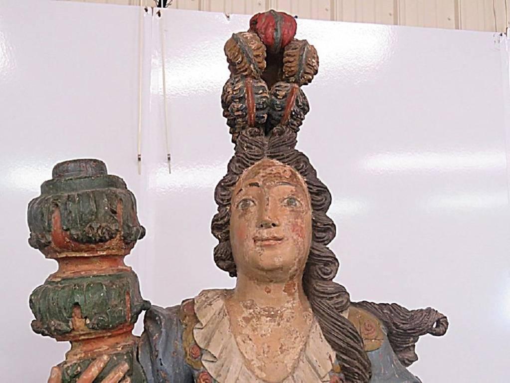 Pair of Santos figural maiden statues on pedestals. Polychromed carved wood. Measures: 81