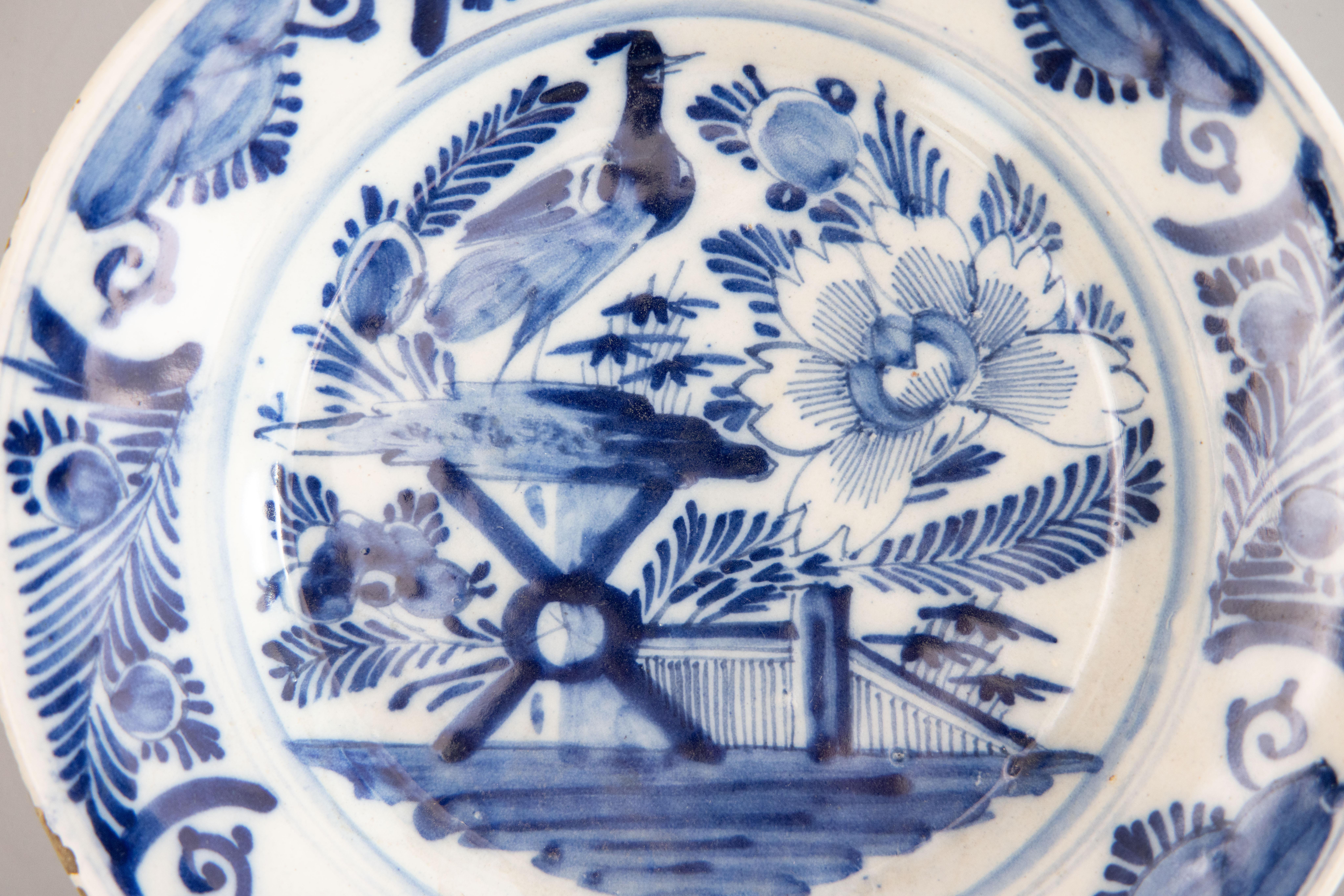 Hand-Painted Pair of 18th Century Dutch Delft Faience Chinoiserie Floral Bird Plates For Sale