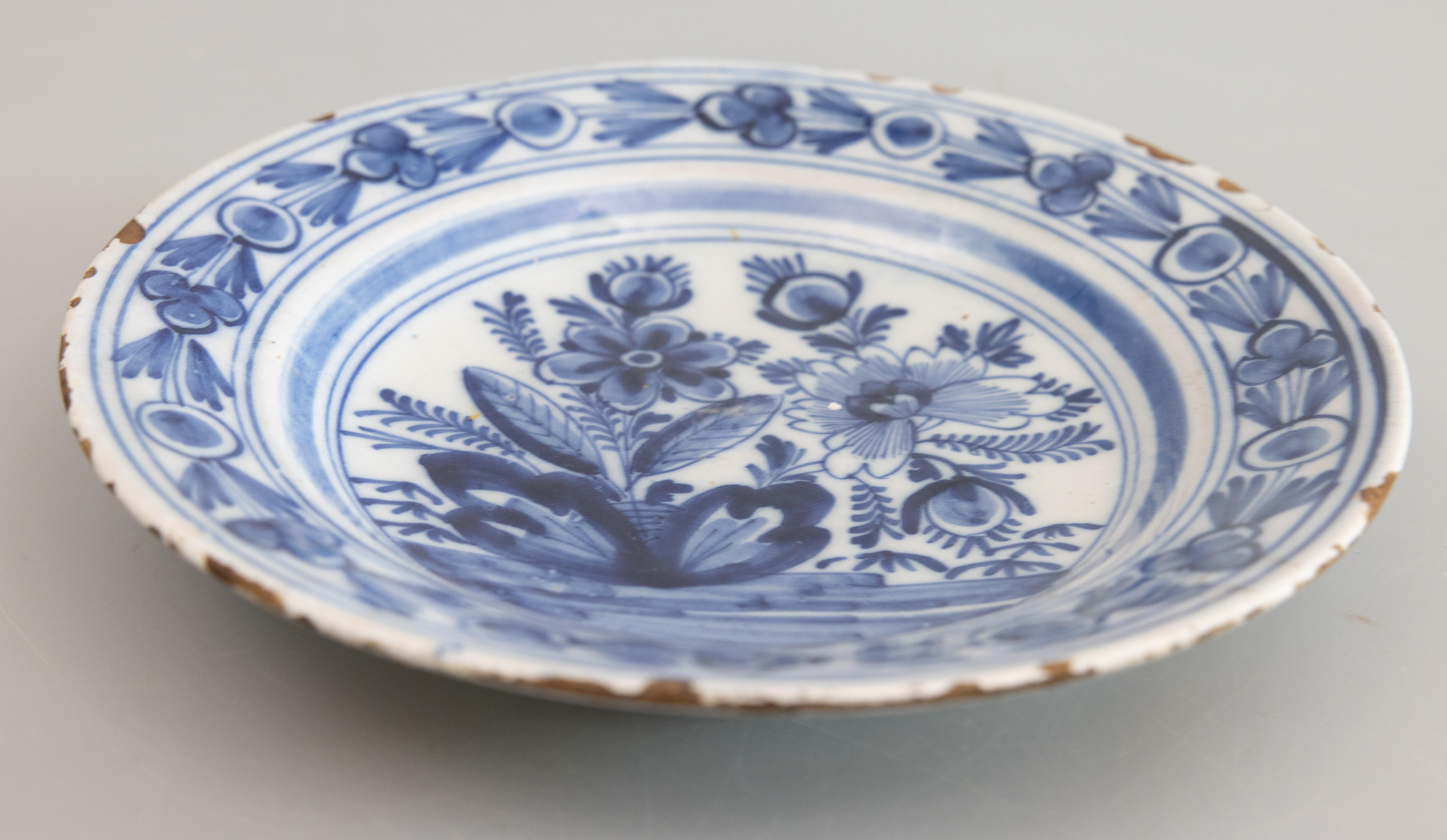 18th Century and Earlier Pair of 18th Century Dutch Delft Faience Floral Plates For Sale