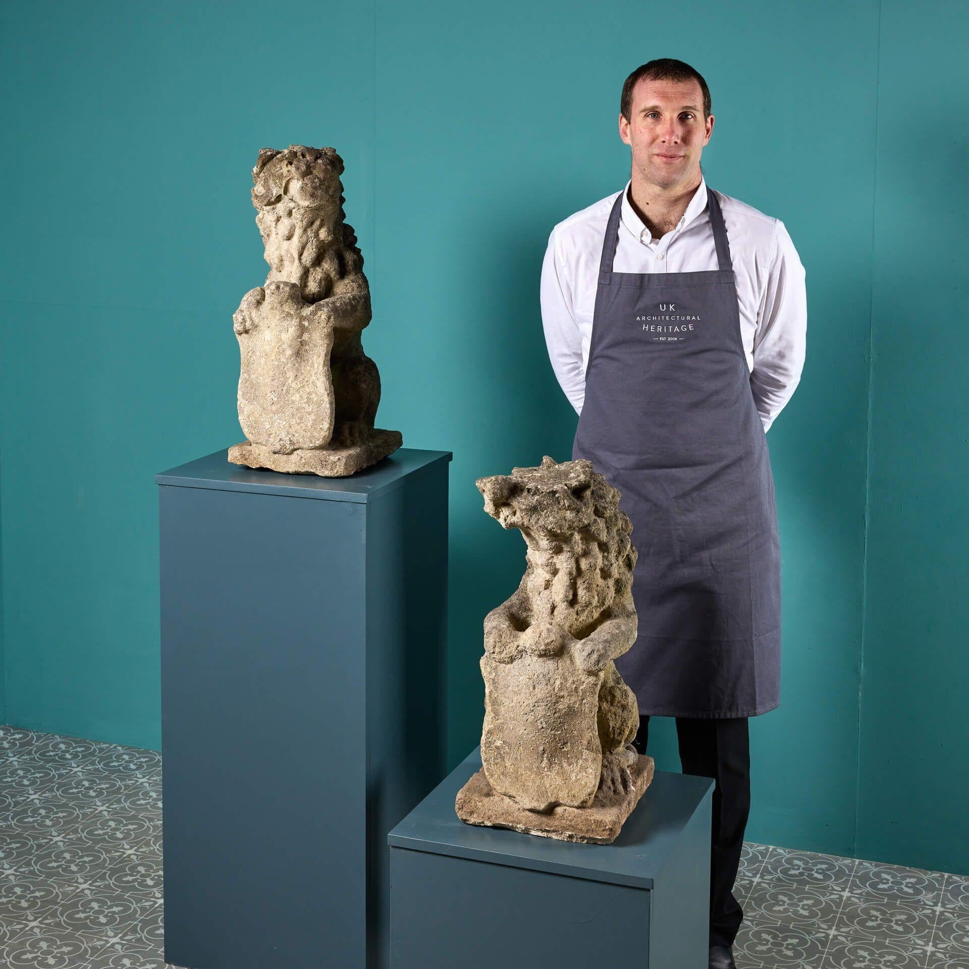 A pair of 18th century antique stone lions reclaimed from a house in South London. Likely originally used as gate piers, this pair of armorial lions make a striking ornamental feature in gardens traditional and modern. Each are stylistically hand