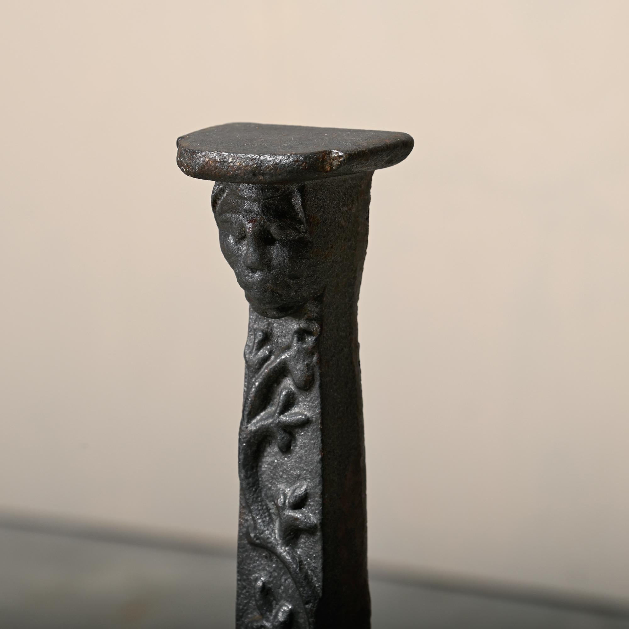Iron Pair of 18th Century French Andirons / Firedogs with faces and flower motif For Sale