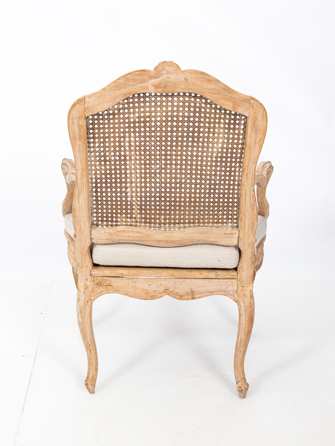 Pair of French armchairs with original stamp and upholstered seat, circa 19th century. Please note of wear consistent with age including a gap in one top rail.