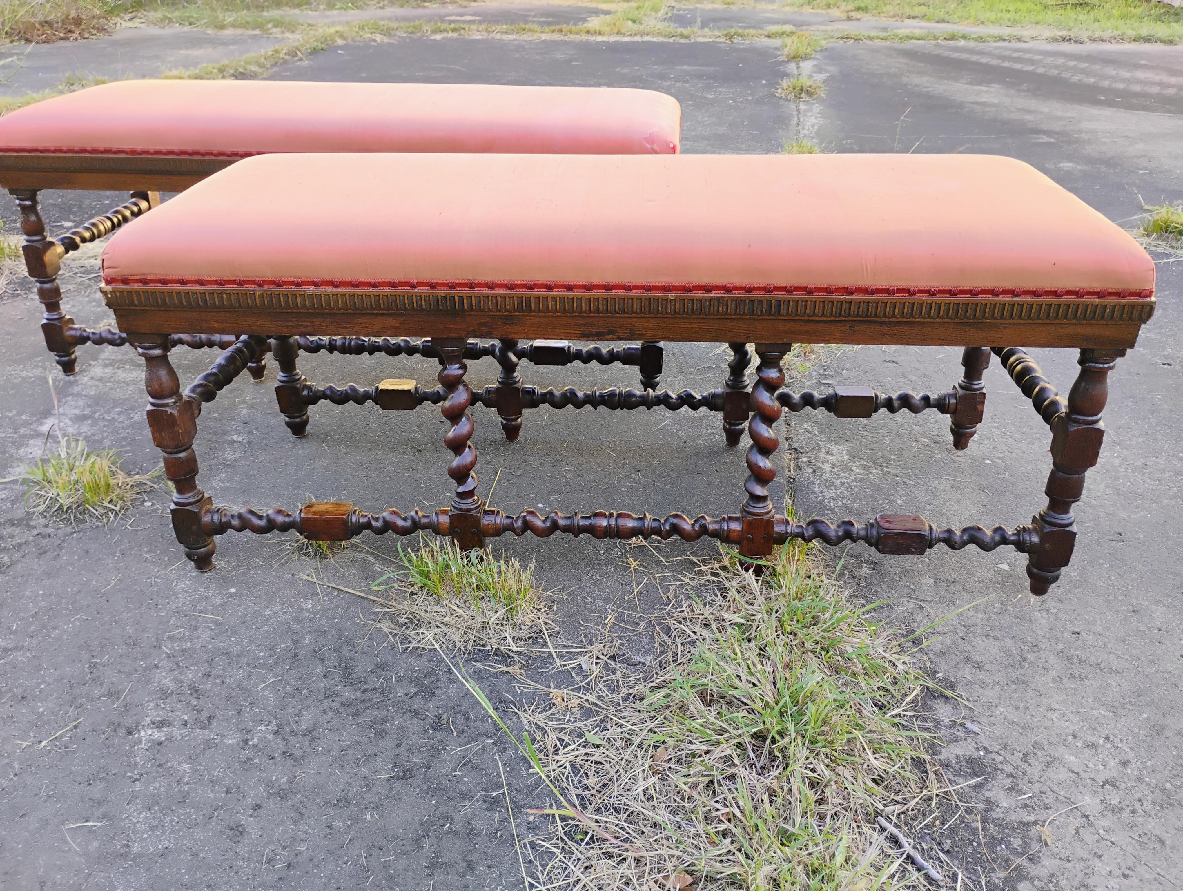 This is a fine pair of Jacobean period Barley Twist Benches.
They were made in France in the mid 18th century..
They're constructed of solid oak and are hand turned.
The benches are put together using wood pegs.
The holes on the underside are an