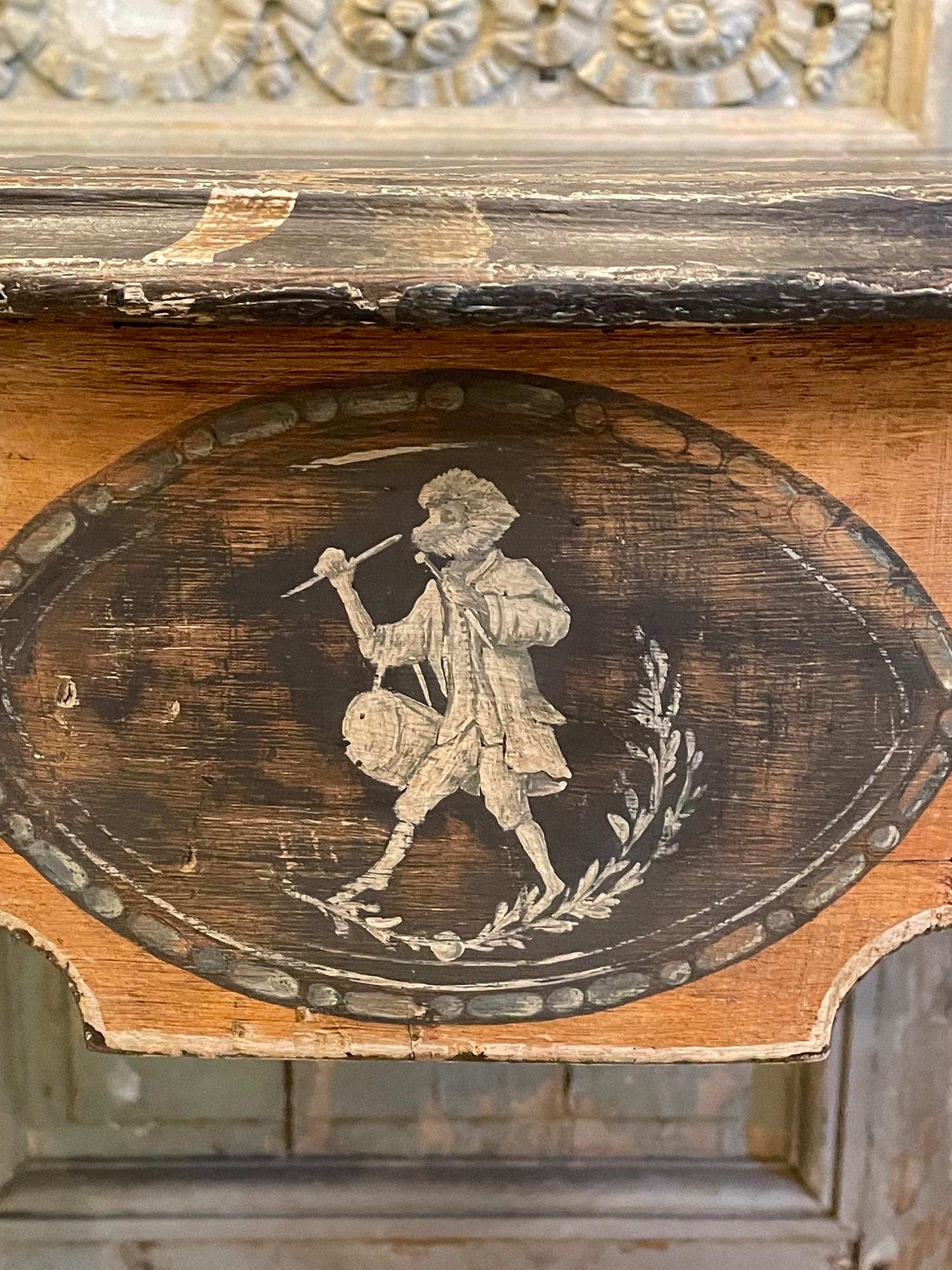 Pair of late 18th century French console tables with lovely faux marble tops, four carved gilt applique of Acanthus leaves and flowerettes on the corners of each table and faux plaques or central ovals depicting monkeys (one is fishing and the other