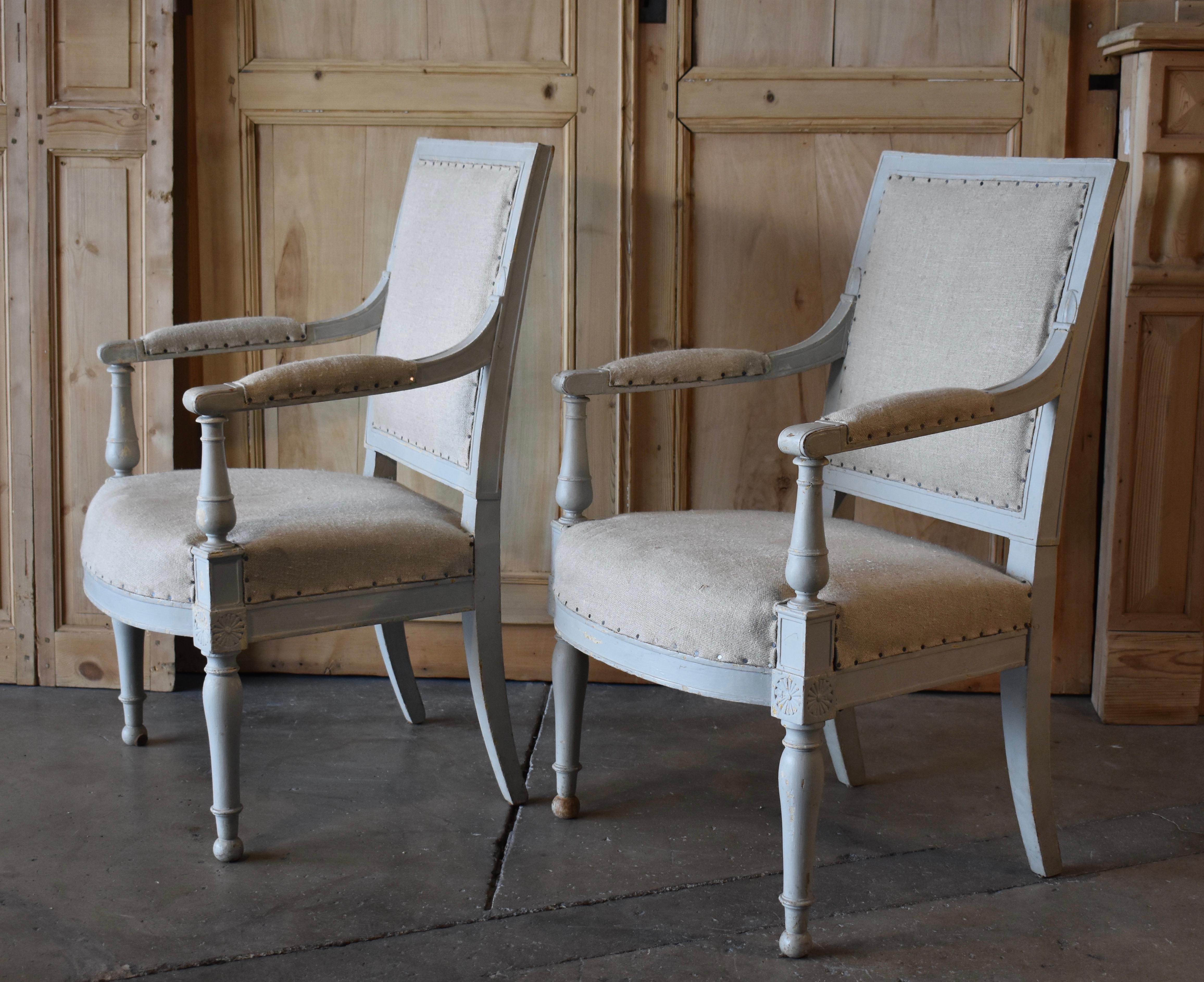 Very nice pair of period French Directoire bergère chairs. Lovely old blue gray paint, but not original. Classical detailing and form, Paris, France.
