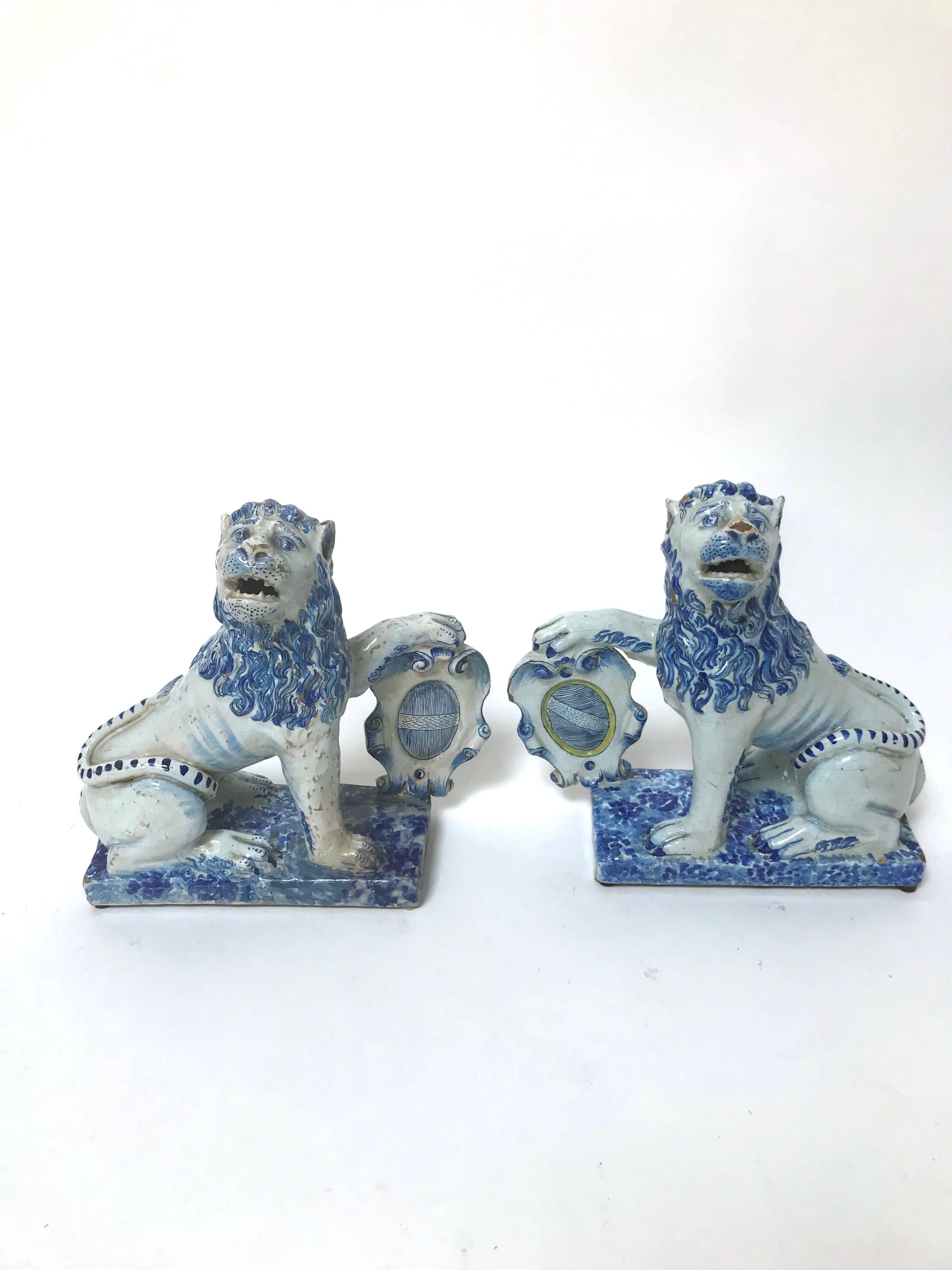 A charming pair of French lions in Faience earthenware in blue monochrome, attributed to Rouen, France, late 18th century

These lions were influenced by Chinese foo dogs placed in temples or at home to protect members of a family, the French