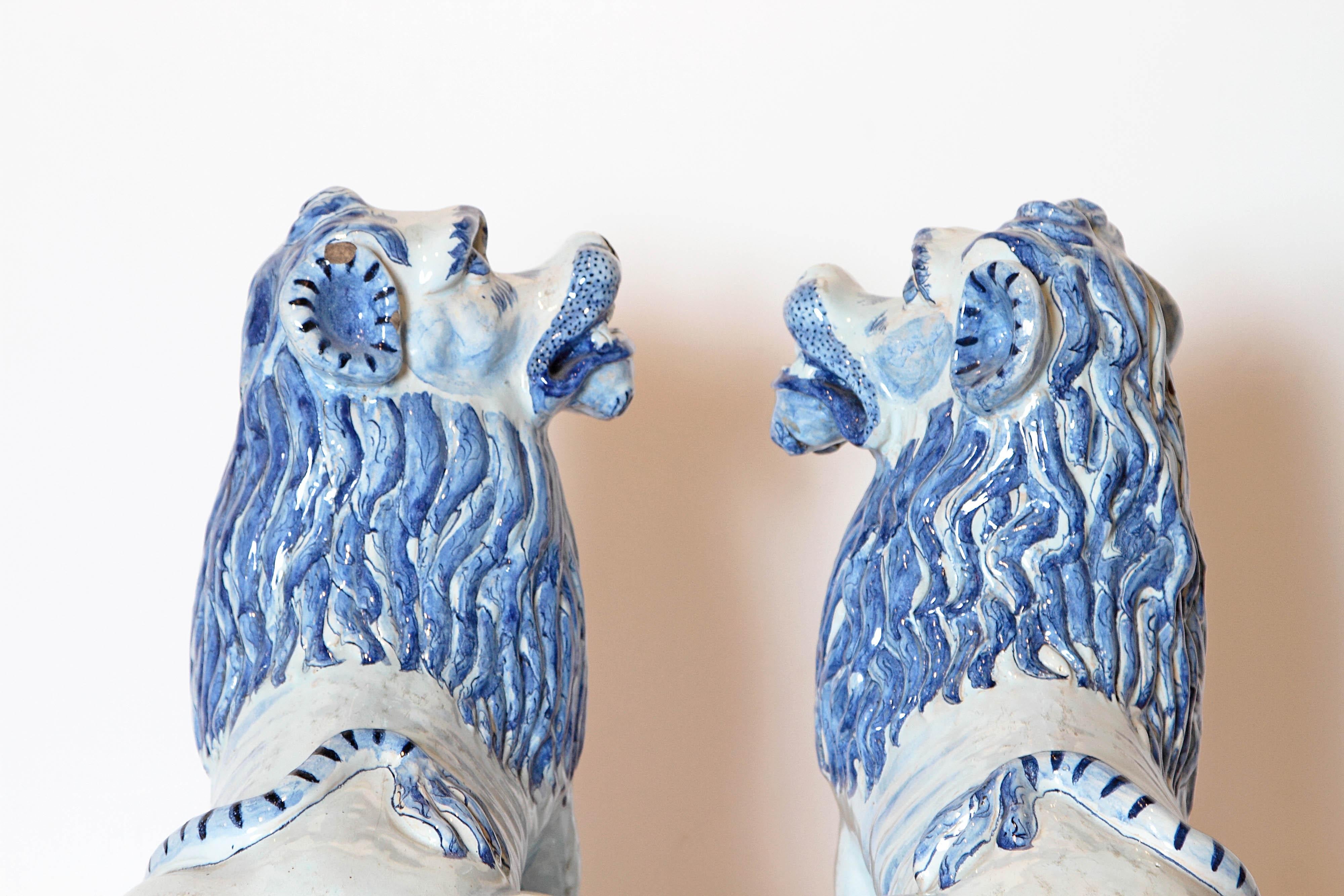 Glazed Pair of 18th Century French Faience Seated Lions