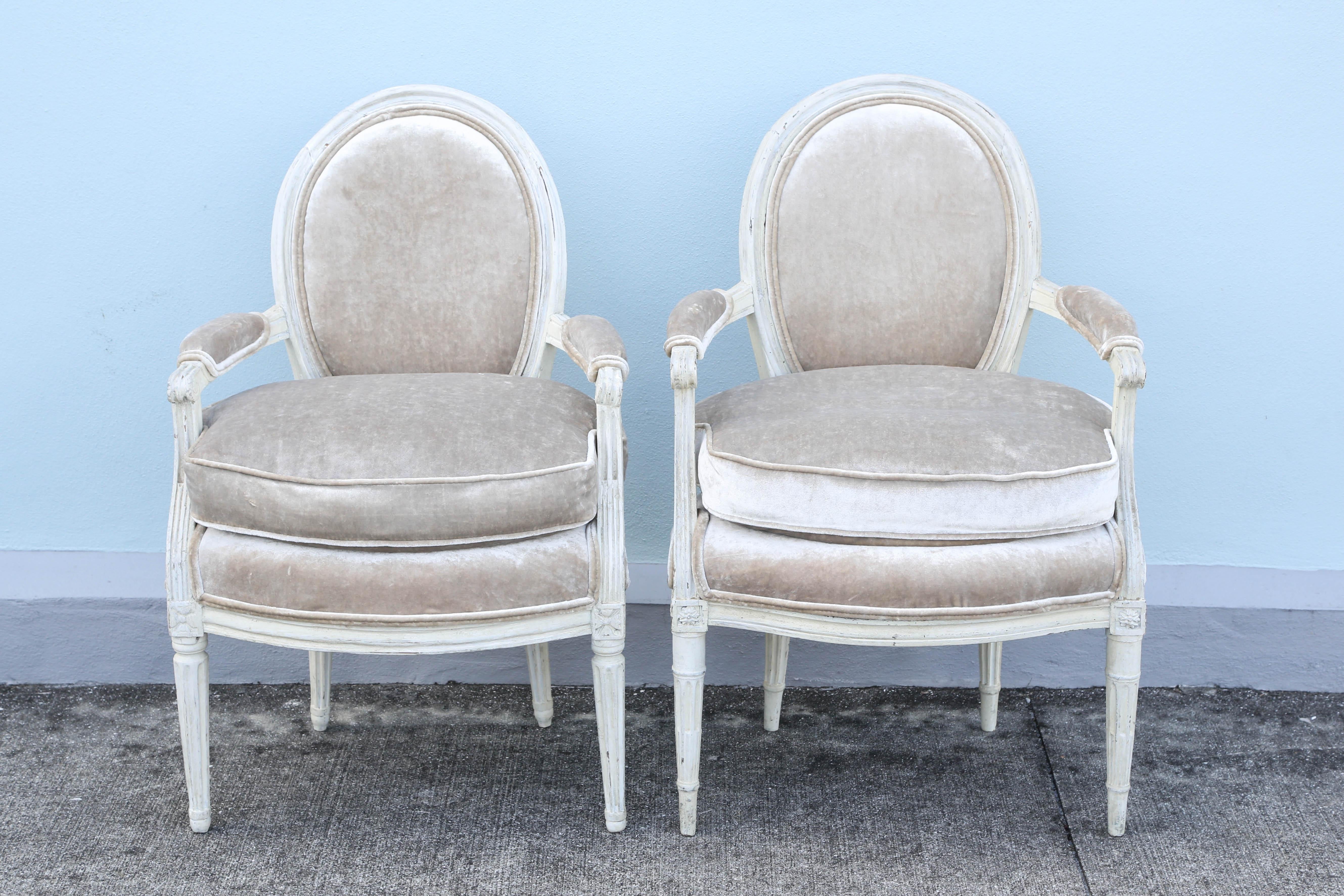 Faux pair of Period Louis XVI armchairs newly upholstered in velvet with ribbed silk backs.