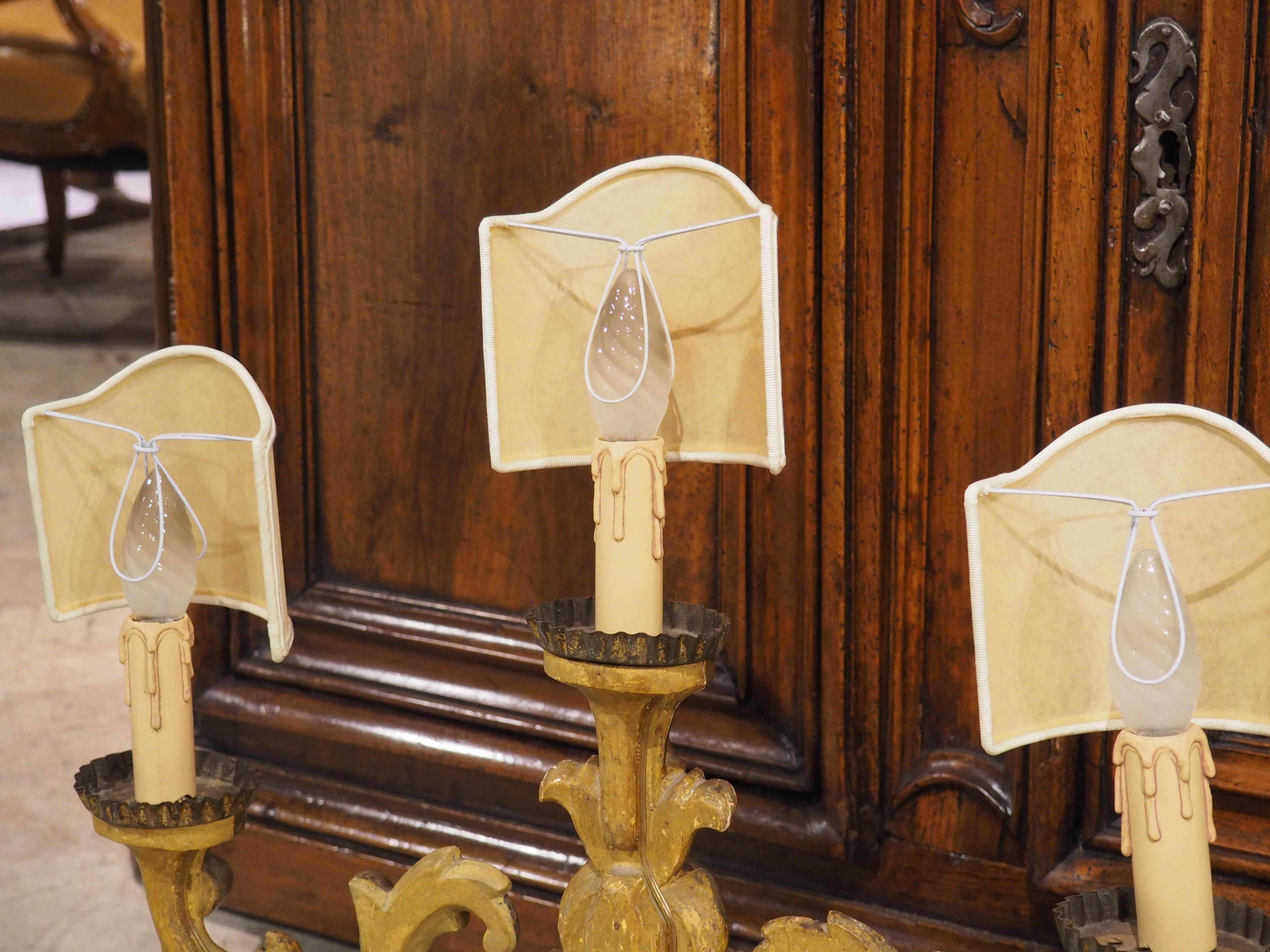 Hand-Carved Pair of 18th Century French Gold Leaf 3-Light Candelabra Lamps with Monogram For Sale