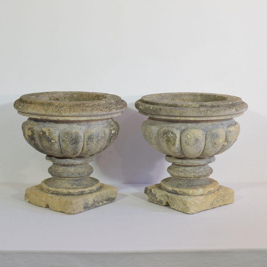 Beautiful pair weathered hand carved stone vases/planters with stunning patina and traces of color.
Hand carved stone planters having a nicely textured surface. They could be standing alone as decorative objects or could be used as planters.
These