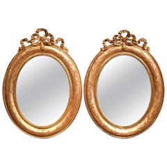 Pair of 18th Century French Louis XVI Carved Giltwood Oval Wall Mirrors
