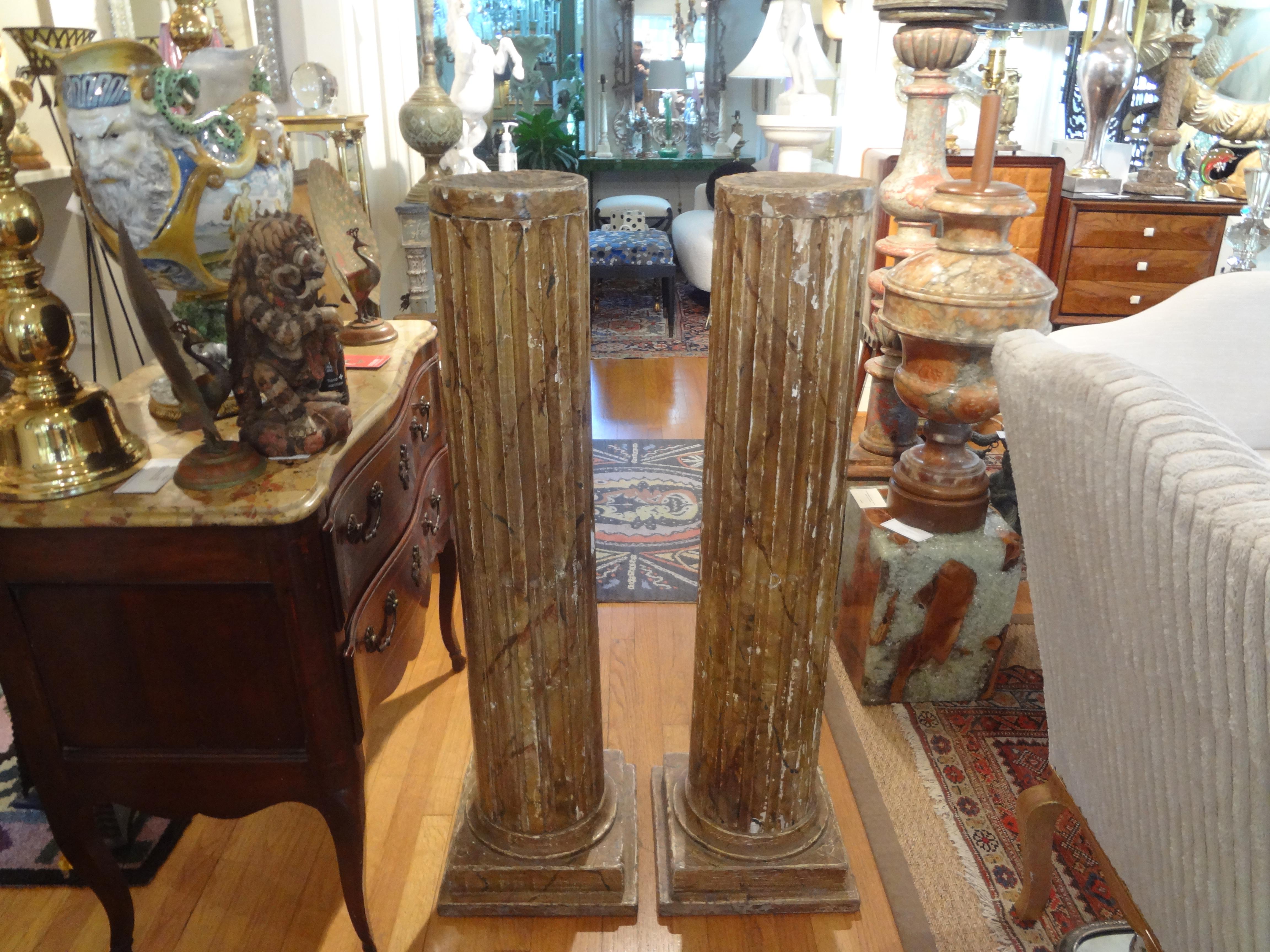 Pair of 18th century French Louis XVI carved wood column pedestals. This gorgeous pair of carved wood with gesso Neoclassical style fluted columns or pedestals are great stand alone pieces. Dimensions of the tops 8.25 inch diameter.
Handsome!