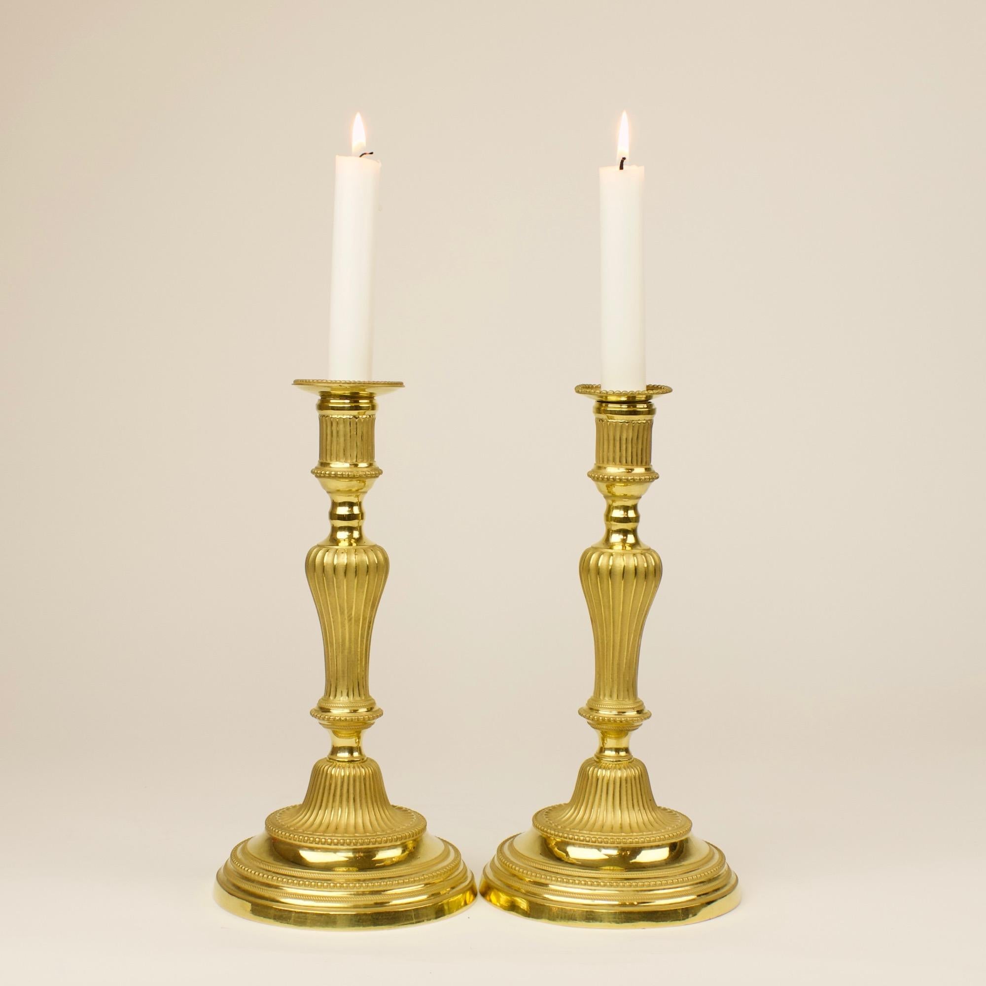 Pair of 18th Century French Transition Louis XVI Gilt Bronze Candlesticks In Good Condition For Sale In Berlin, DE