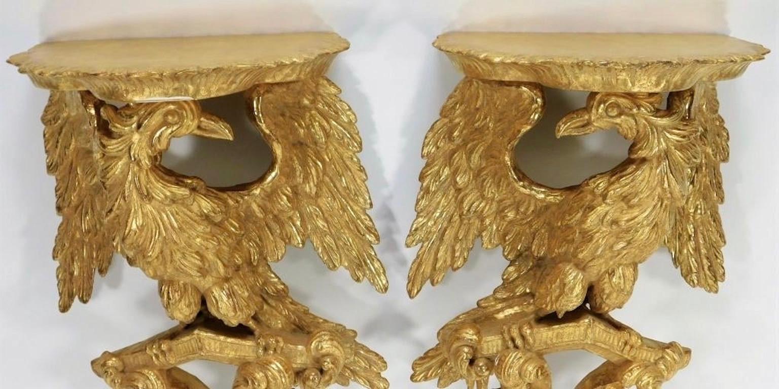Pair of 18th century George II giltwood eagle wall brackets
Each with a scalloped platform over an eagle or ho-ho bird supported on a pediment above floral and foliate embellished C-scrolls, regilt

Provenance: Ex Corporate Collection
