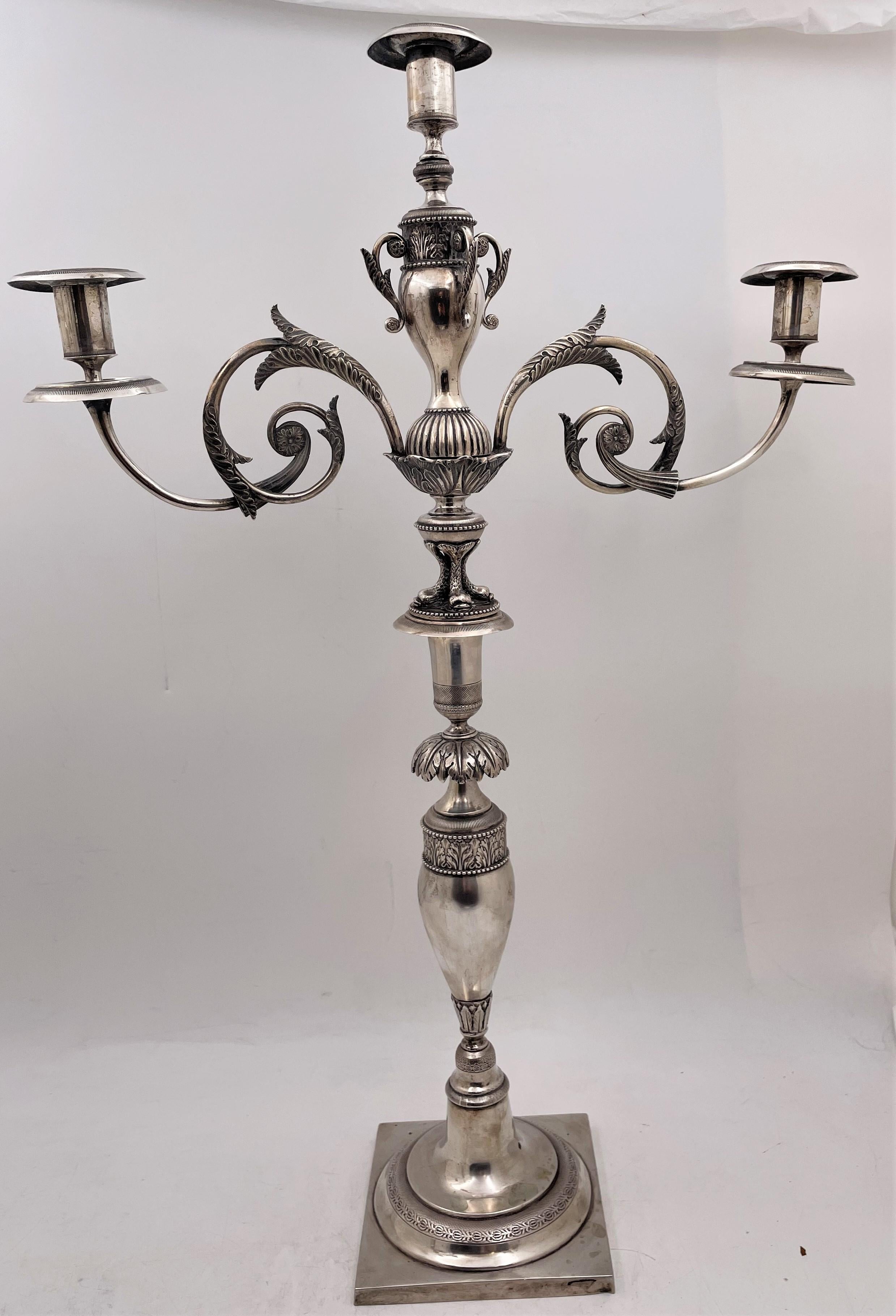 Pair of German silver, 3-light candelabra, probably from the late 18th century, showcasing exquisite natural and animal motifs, including dolphins, measuring 23'' in height by 15 3/4'' from arm to arm by 5'' in depth, weighing 102.4 troy ounces, and