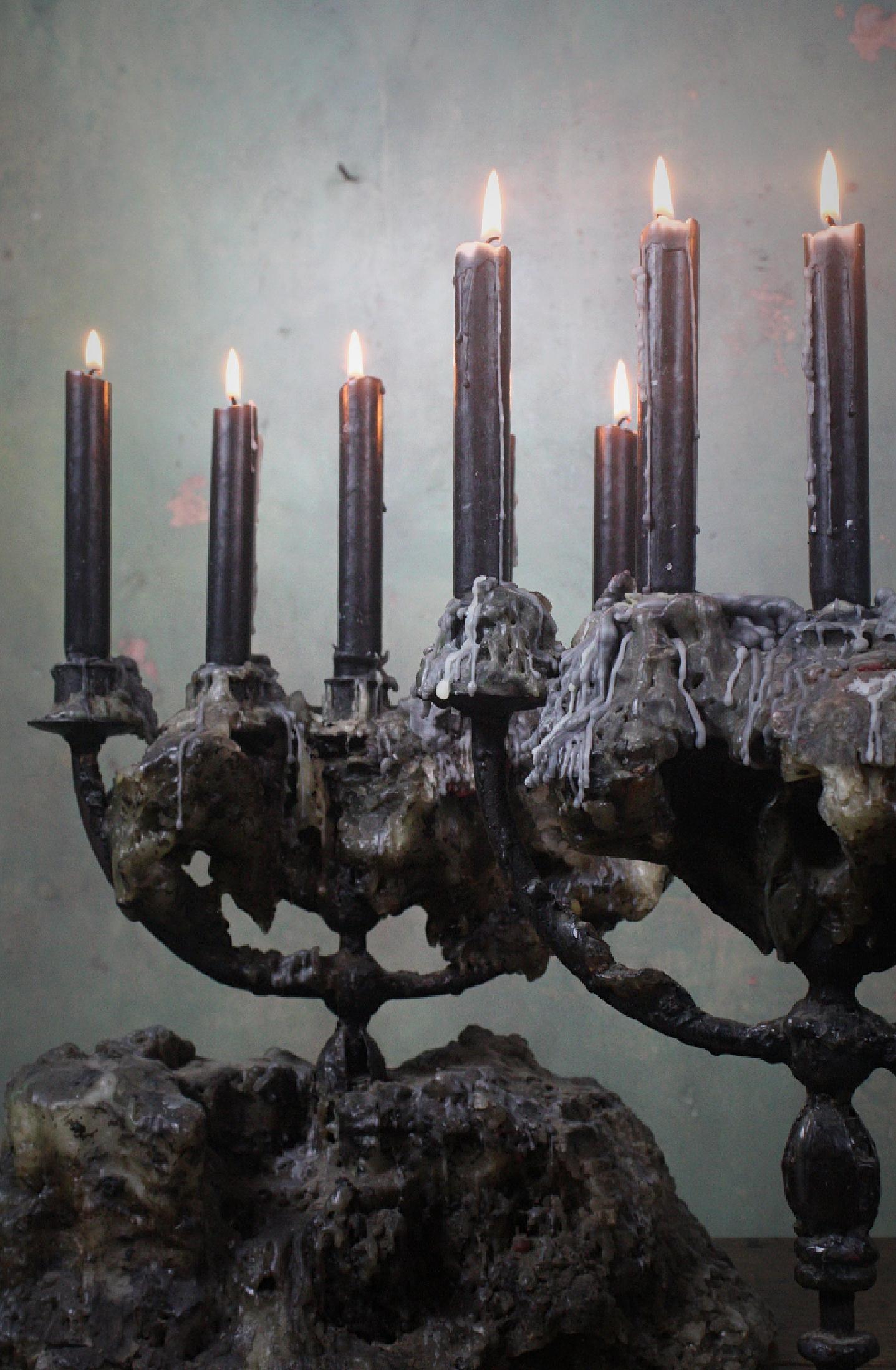 Very decorative pair of 18th century Italian wrought iron candelabras, with a wonderful sculptural concoction of wax build up 

The candelabra with the larger amount of wax is approximate 43cm in width at base 

The pair are 50cm in height