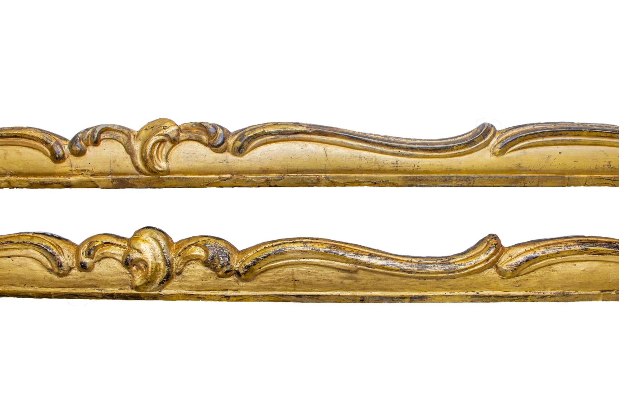 Pair of 18th century Irish Georgian water-gilt gold leaf curtain pelmets. They are from a stately home in Ireland and they have intricate and detailed wood carvings.