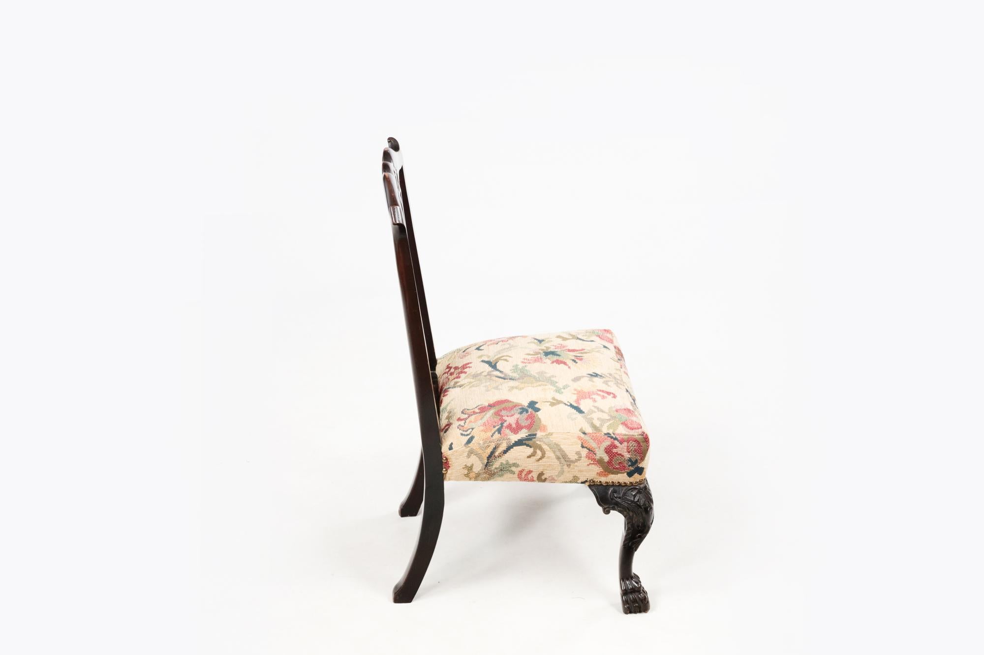 A pair of neat-sized 18th century Irish miniature chairs attributed to Butler of Dublin. Featuring a bow-shaped top rail, pierced tapering splat, simple back legs. To the front highly decorated front cabriole legs terminate with hairy paw feet.