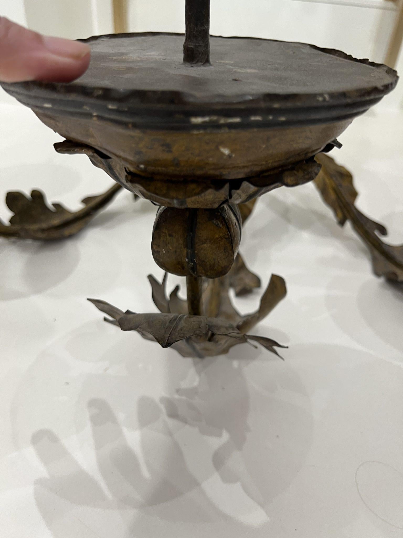 Iron and tole sconces; acanthus leaves are painted a sophisticated shade of ochre.
We have fabricated special brackets for hanging the sconces
They have not been wired for electricity.
There are two pair available.  Priced per pair..