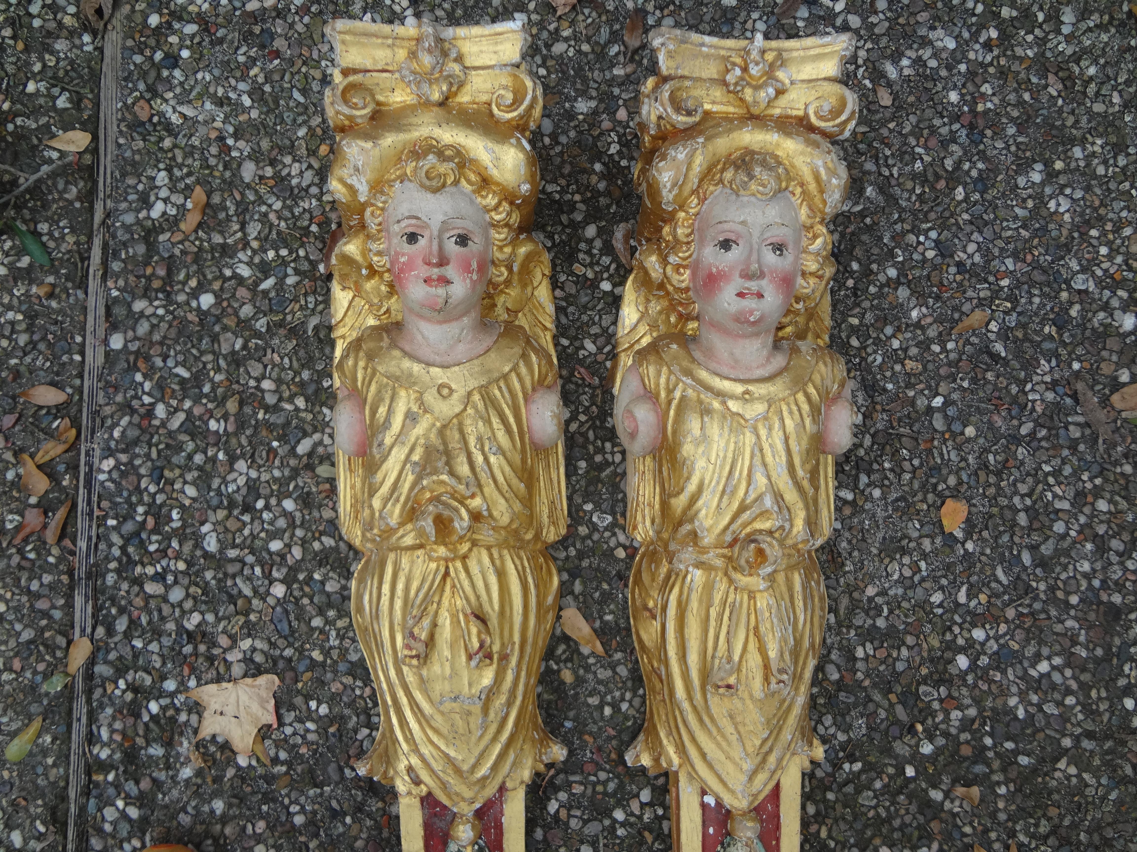 Stunning pair of 18th century Italian Baroque carved painted and giltwood caryatid architectural elements. These beautifully carved antique Italian pilaster columns, wall brackets, corbels or fragments are beautifully decorated. Great patina!.