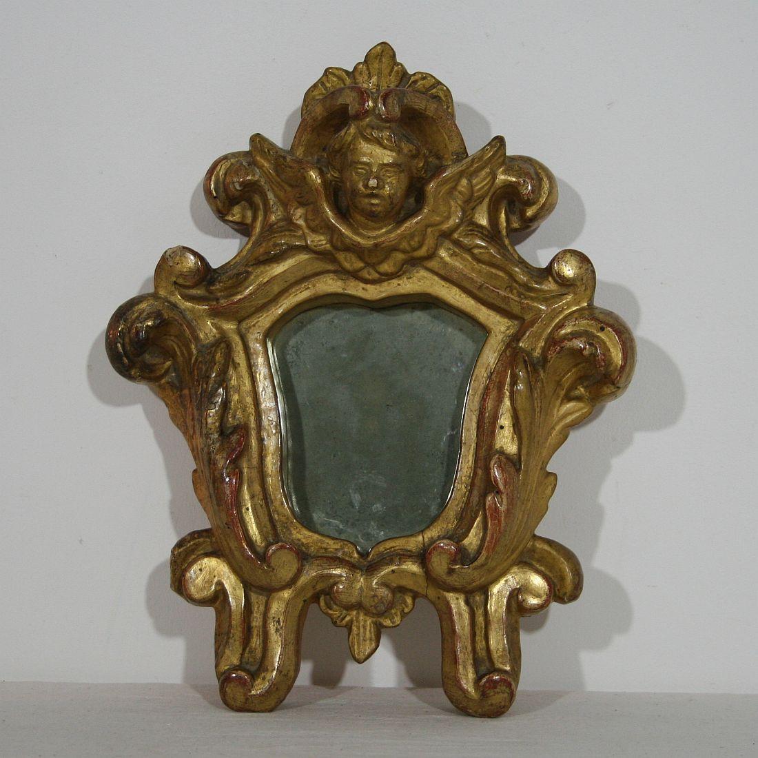 Unique pair of giltwood baroque mirrors with carved angel heads,
Italy, circa 1750
Weathered.