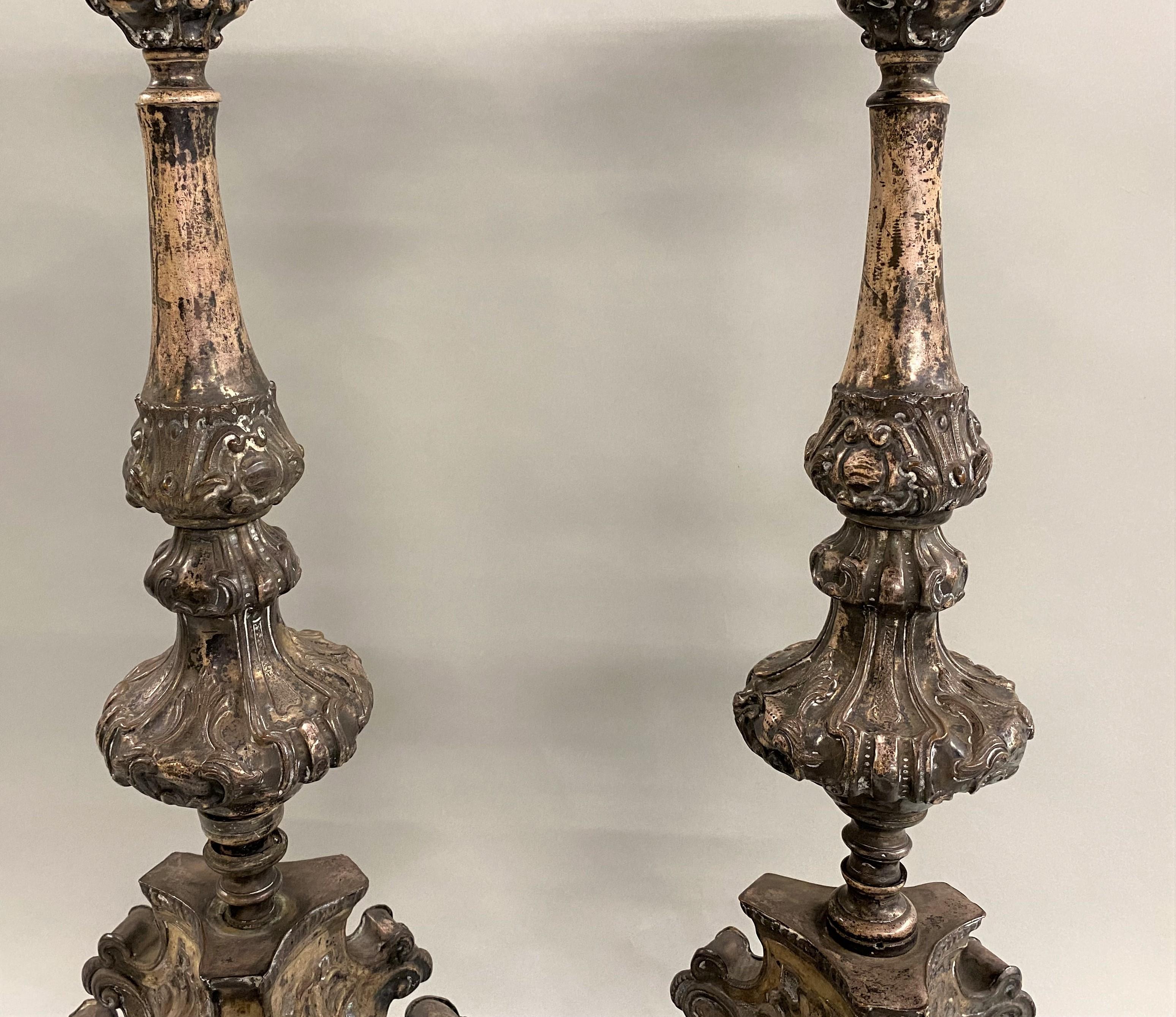 Hand-Carved Pair of 18th Century Italian Baroque Style Pressed Metal Candlesticks For Sale