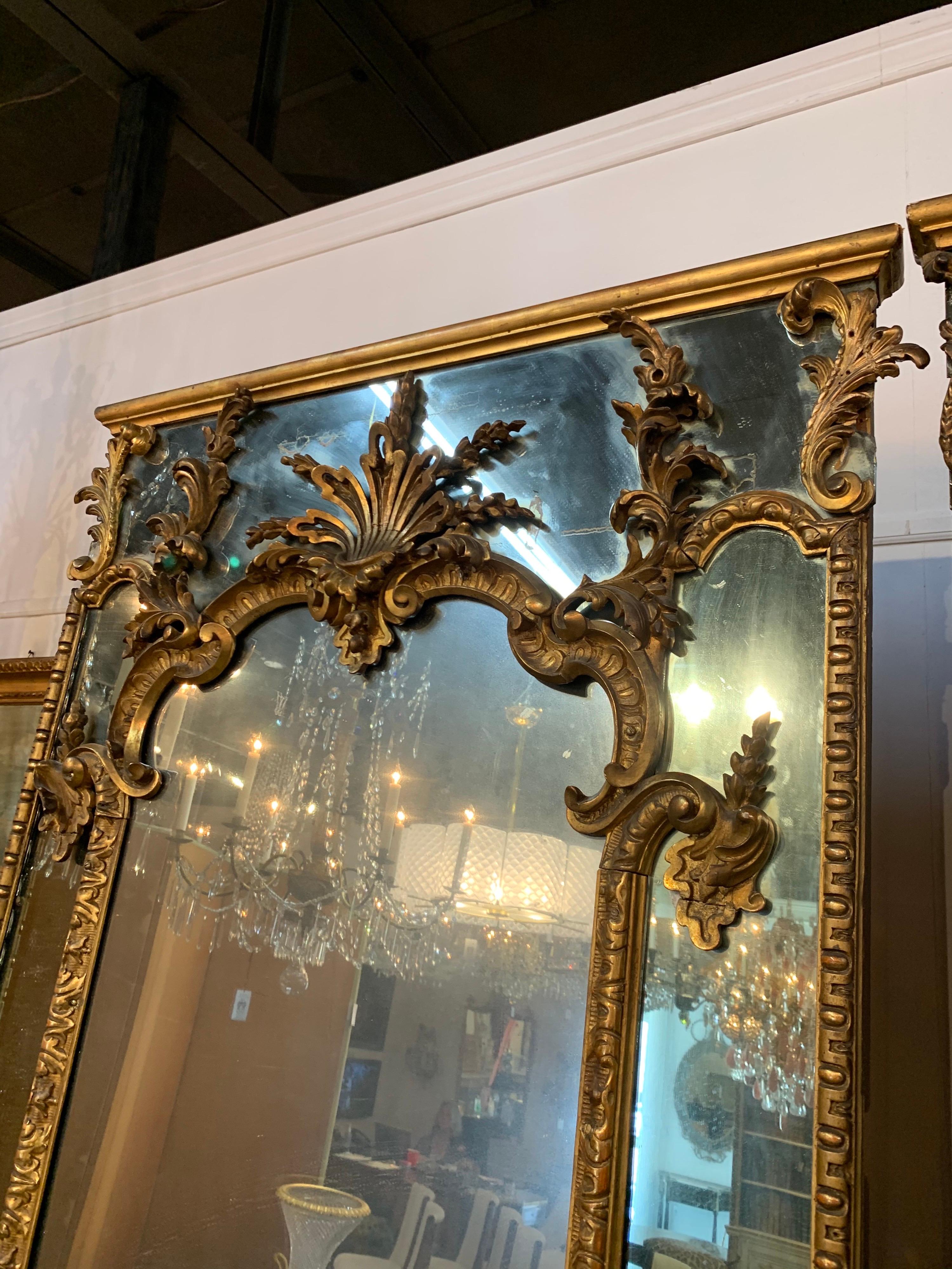 Mercury Glass Pair of 18th Century Italian Carved and Giltwood Floor Mirrors For Sale